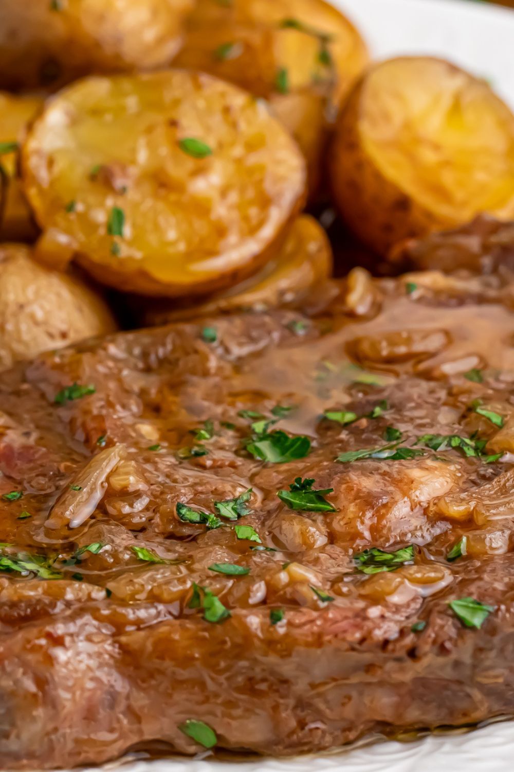 Crock Pot Steak and Potatoes- close up of steak and potatoes on a plate 