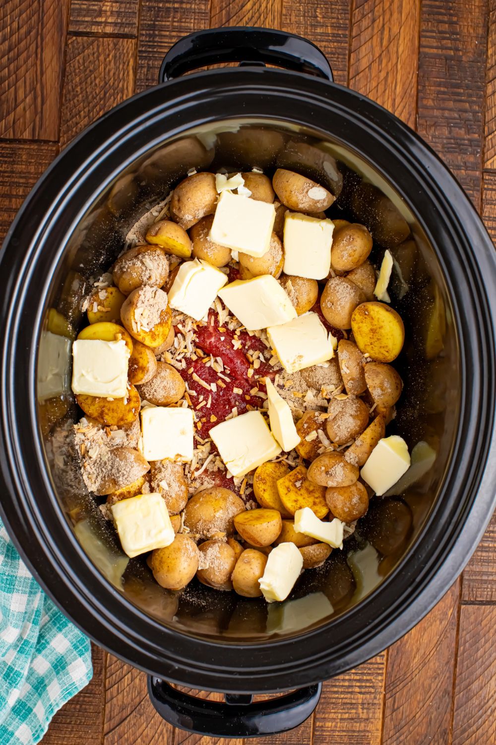 slabs of butter on top of the Crock Pot Steak and Potatoes