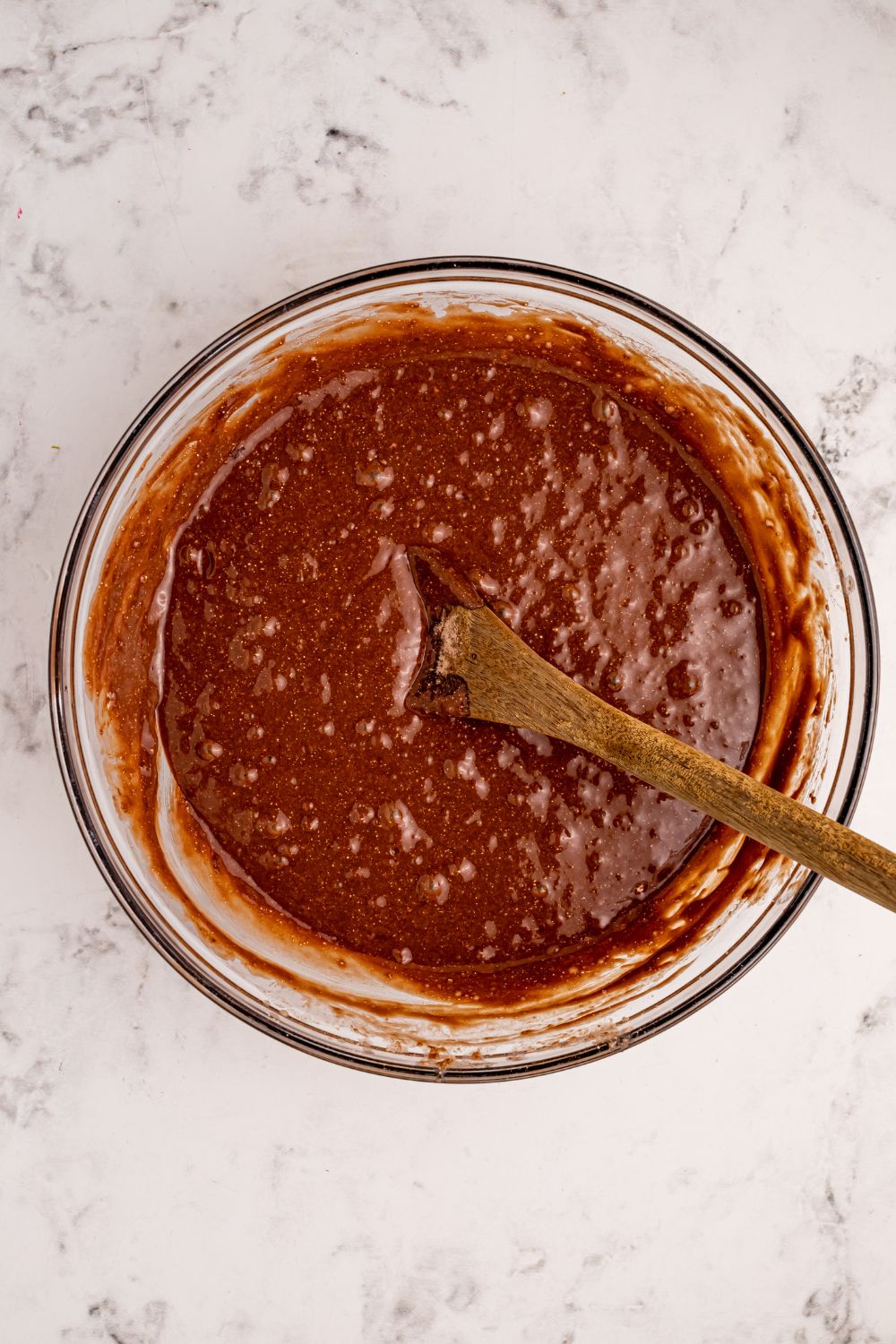 chocolate cake batter in a glass bowl 