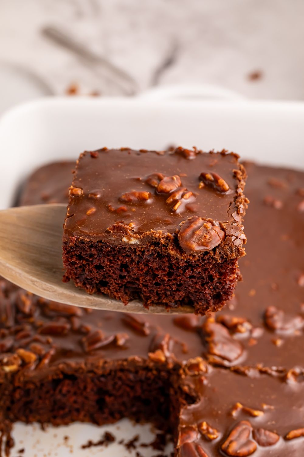 chocolate cake with a dr pepper glaze on top in pan