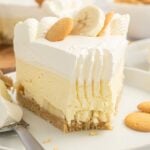 No Bake Banana Pudding Cheesecake on plat with a fork bite taken out of the slice