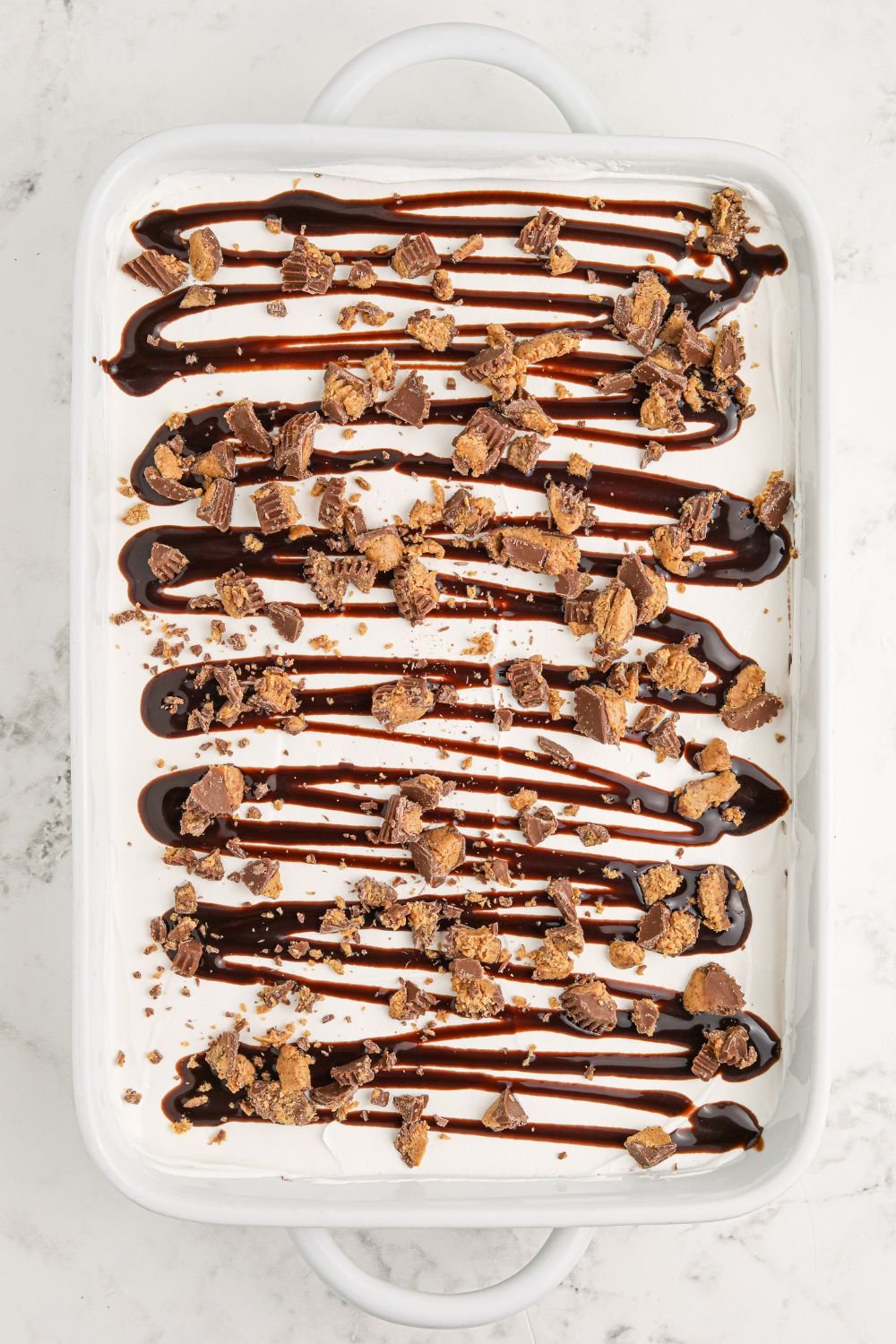assembled Reeses Lasagna in a pan on table 