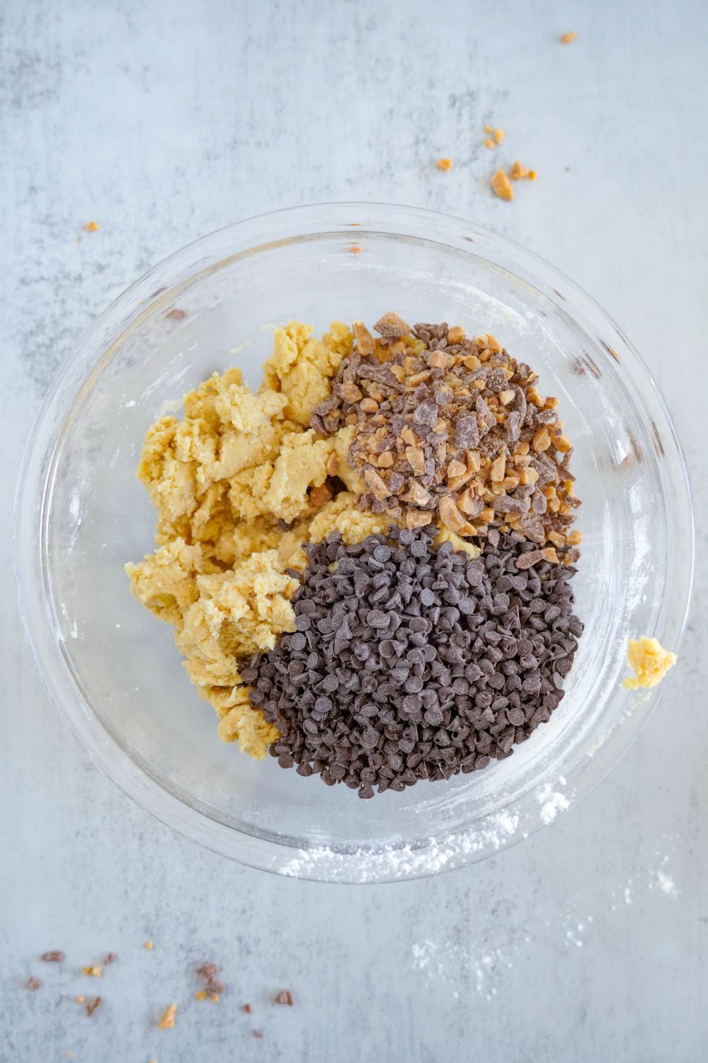 Chocolate Chip Toffee Cookie dough batter with toffee and chocolate chips on top 