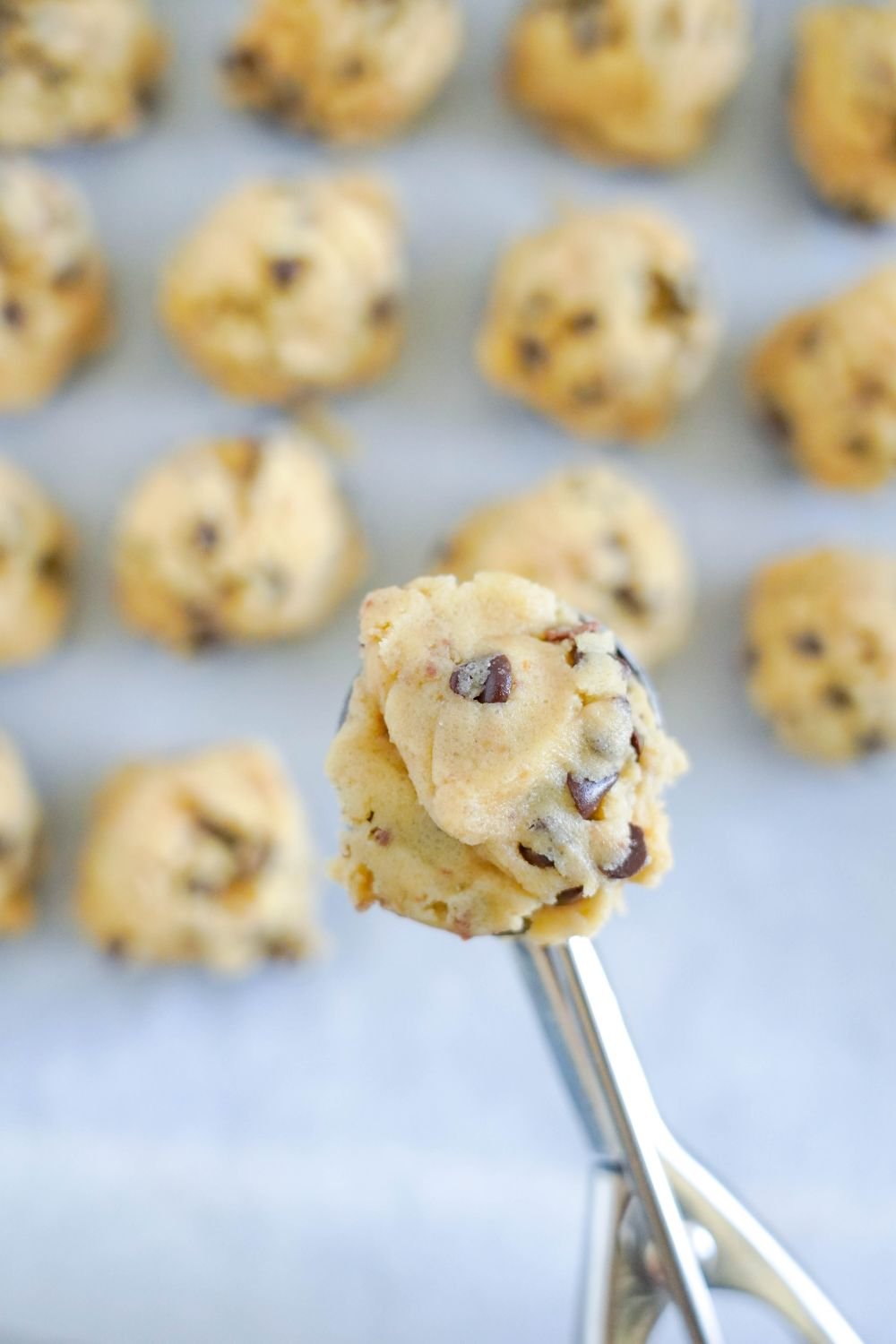 Chocolate Chip Toffee Cookie dough in a cookie scoop 