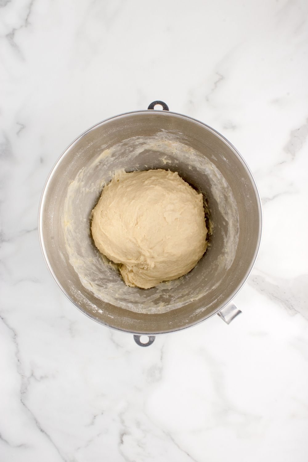 pull apart roll dough formed into a ball in a mixing bowl 