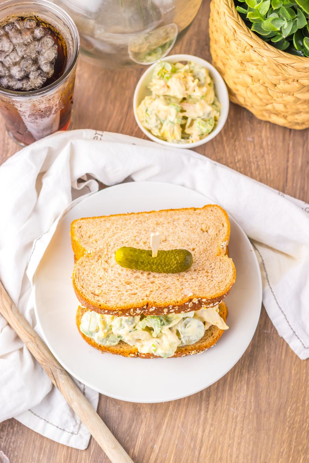 Pickle Chicken Salad on plate with a soda in glass to the side 