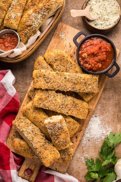 overhead shot of Copycat Pizza Hut Breadsticks on a wooden cutting board