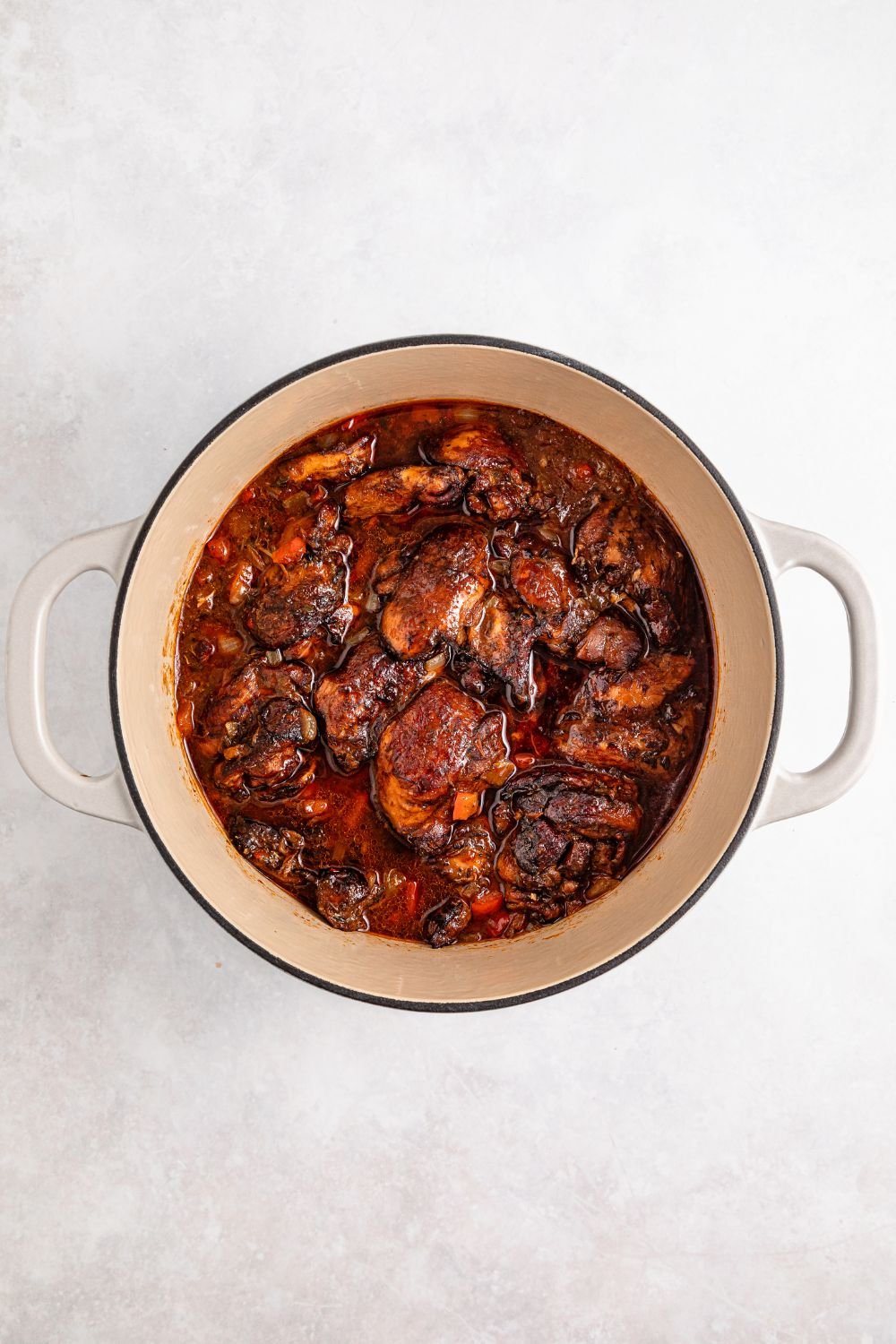 Dutch Oven with cooked Jamaican Brown Stew Chicken  