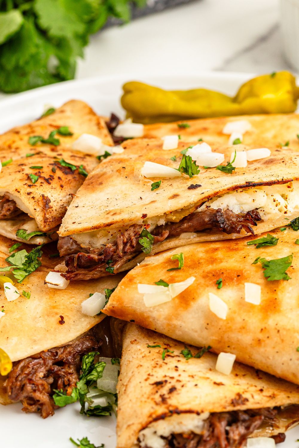 Mississippi Pot Roast Quesadillas piled on a plate 