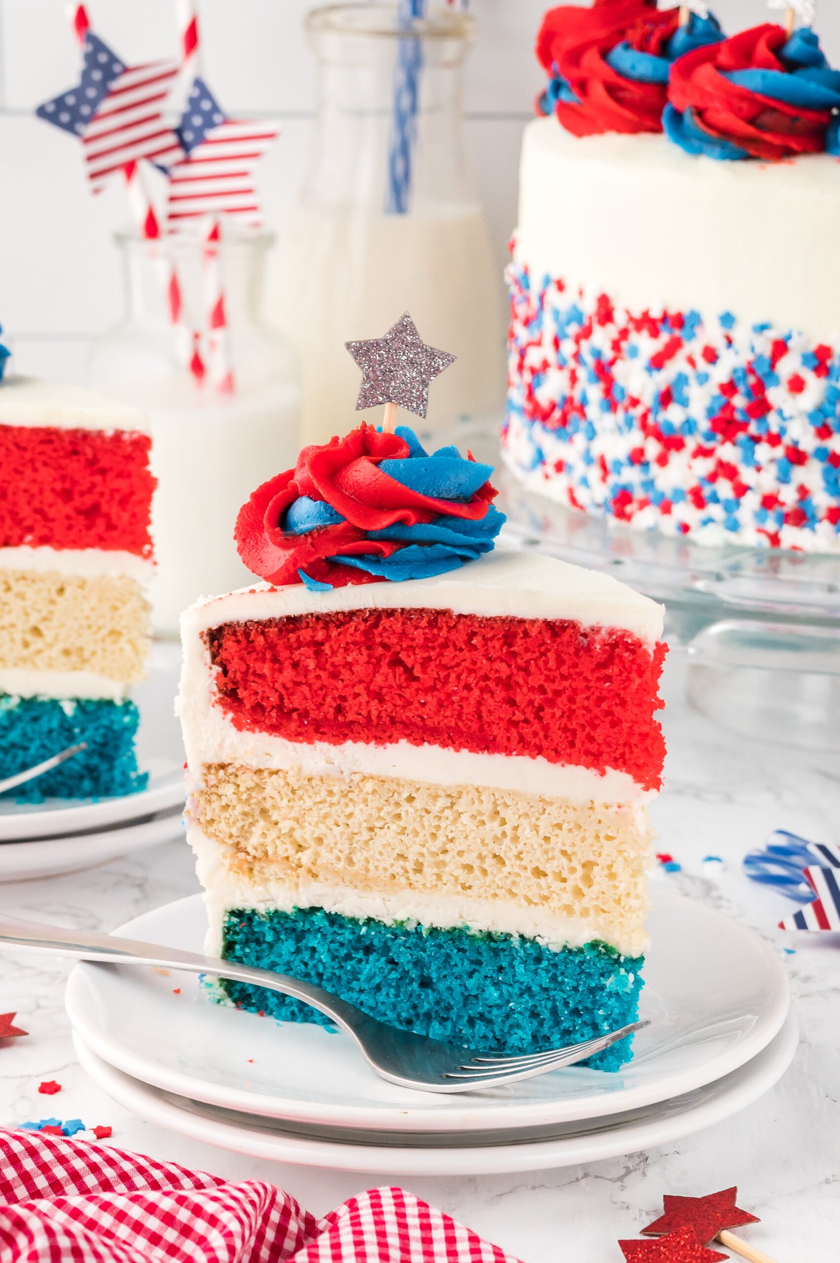 Slice of American Flag Layered Cake on a white plate 