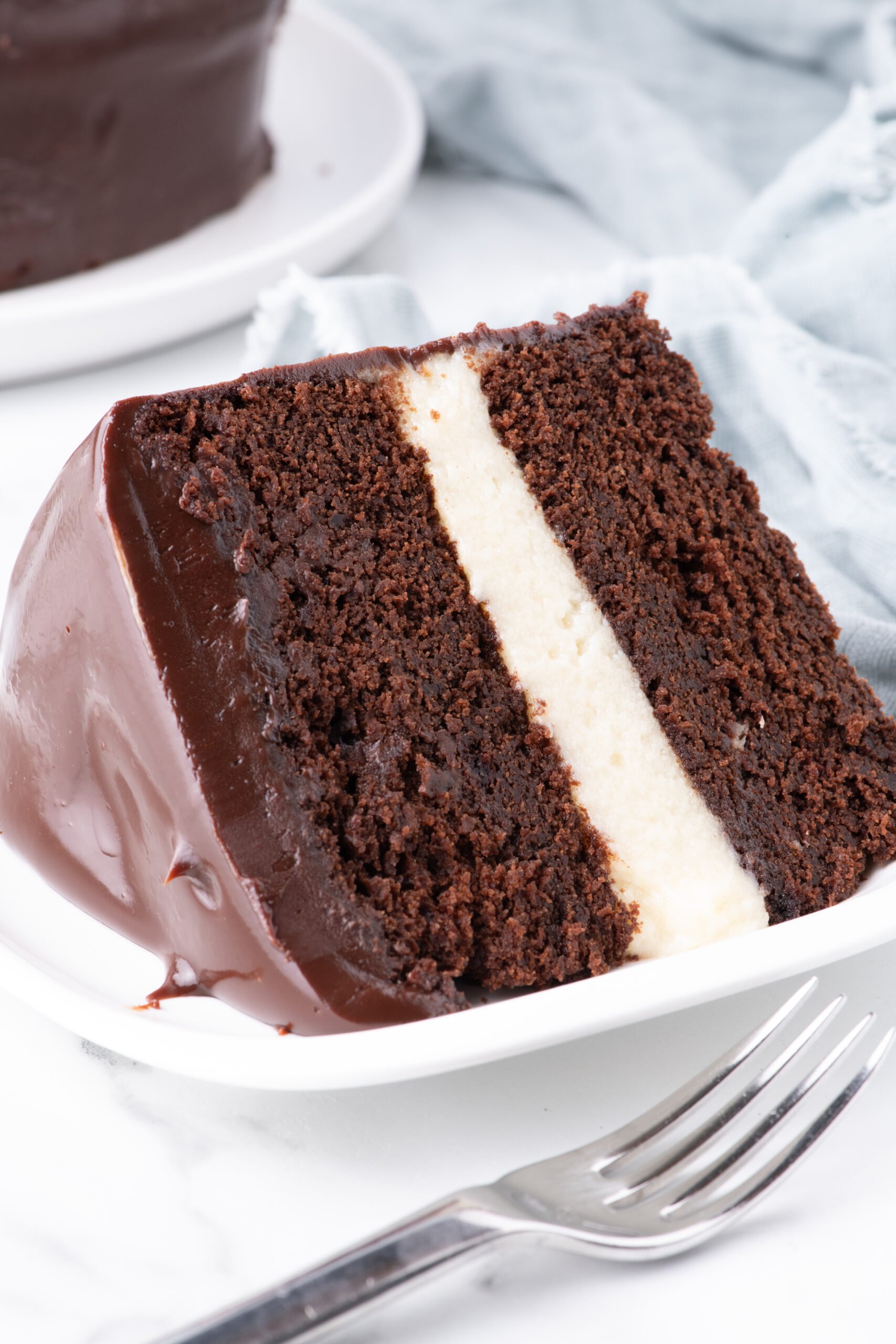 up close shot of Slice of Ding Dong Cake on a white plate showing the  center