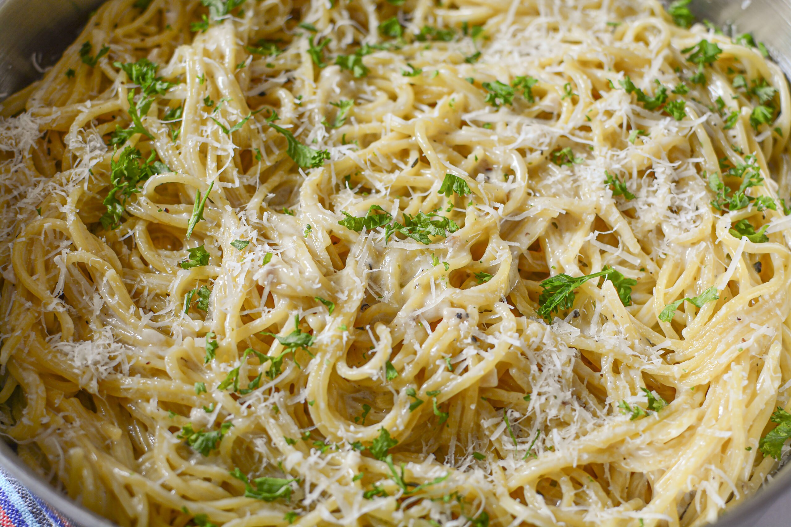 Garlic Parmesan Pasta in a stainless steel skillet 