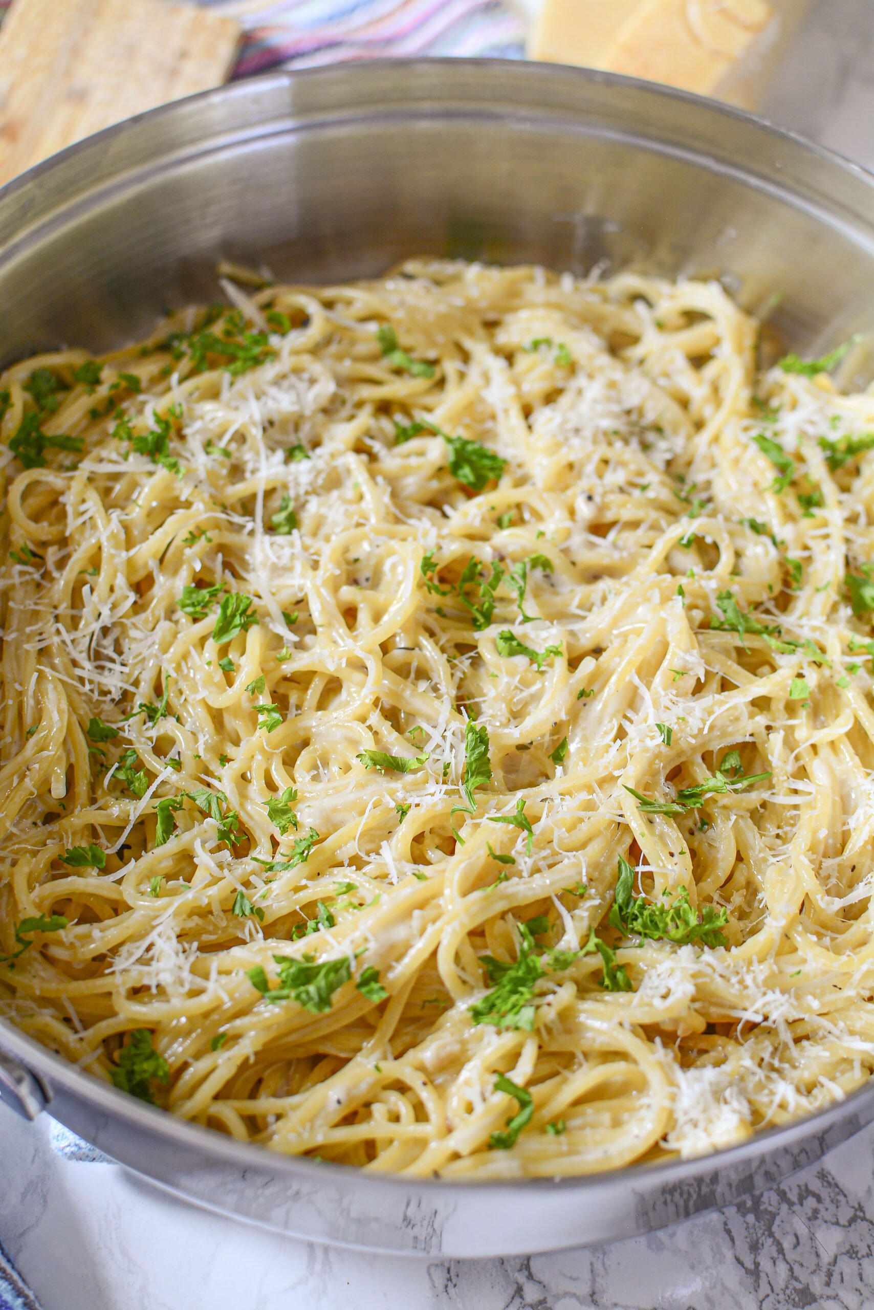 up close shot of the Garlic Parmesan Pasta in a skillet on a marble table 