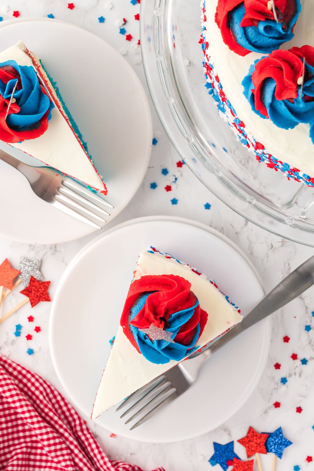American Flag Cake with slices of cake on plates with forks by them 