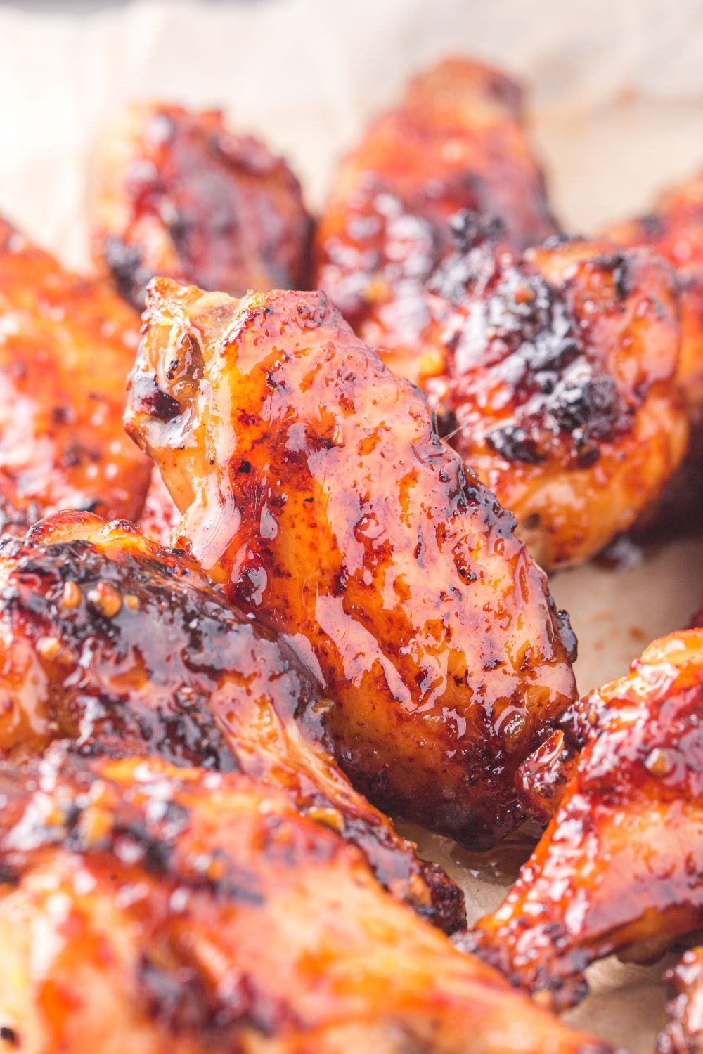 air fried chicken wings with a glaze spread out on table