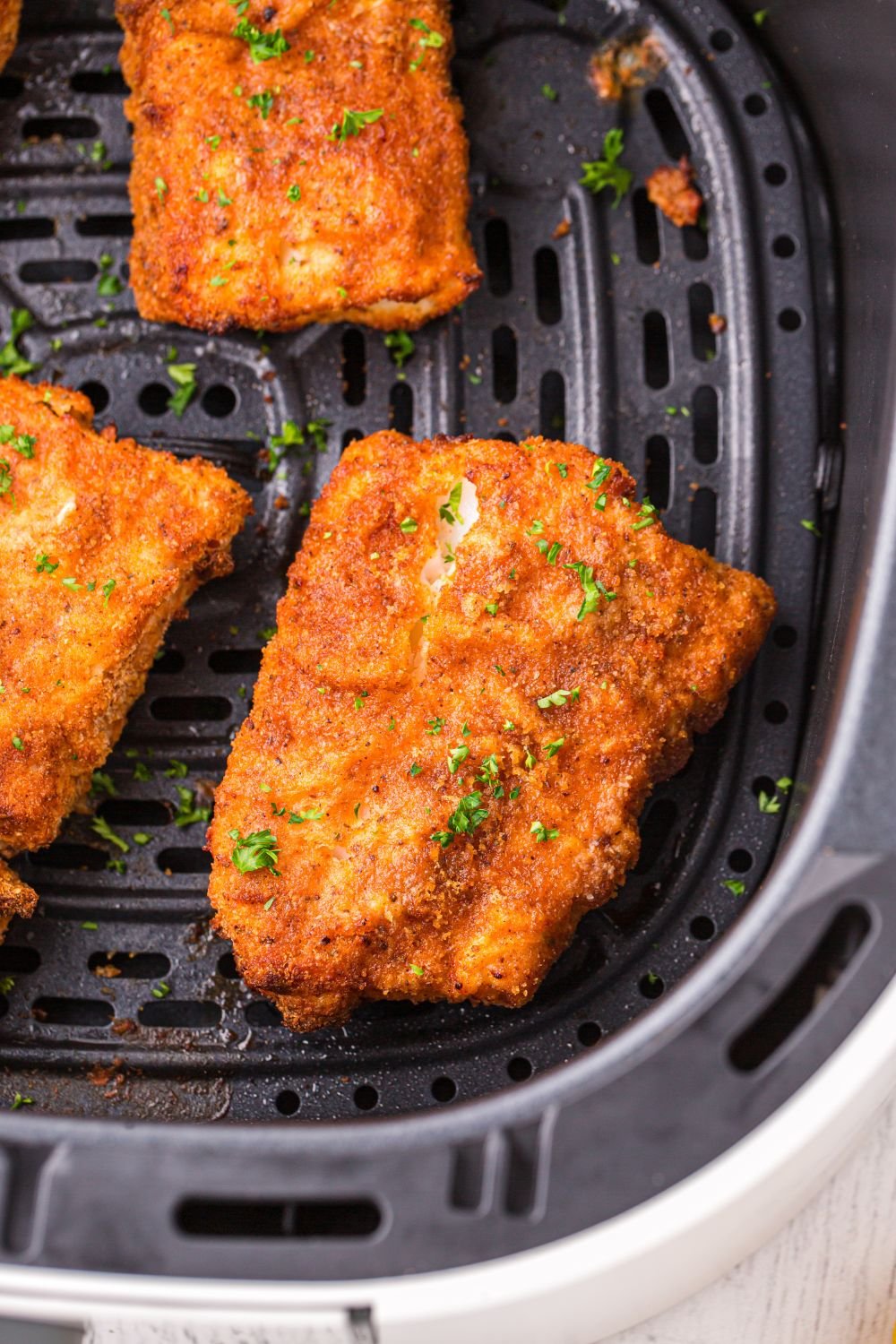 Air Fryer Fish in air fryer basket 