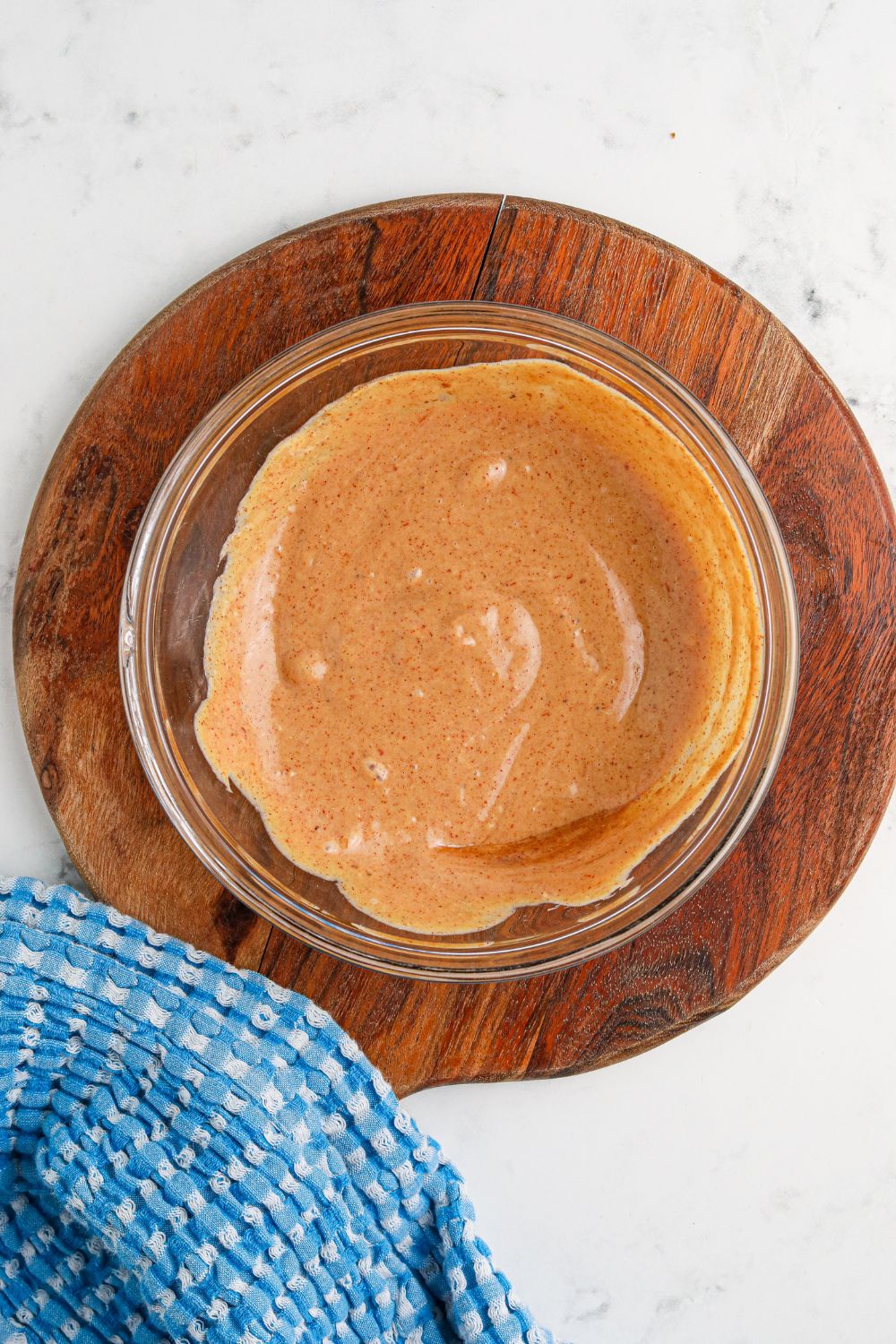 Cowboy Burger sauce mixed in a bowl on wooden cutting board 