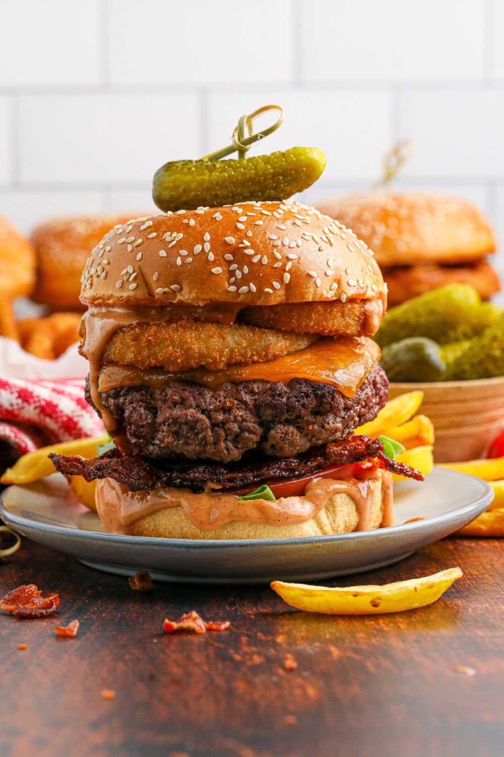 plates with Cowboy Burgers on each of them and a small fry in front of the plate 