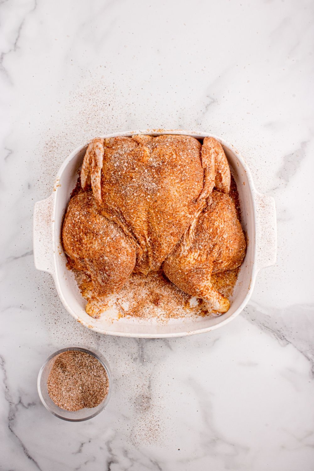 container with seasoned chicken