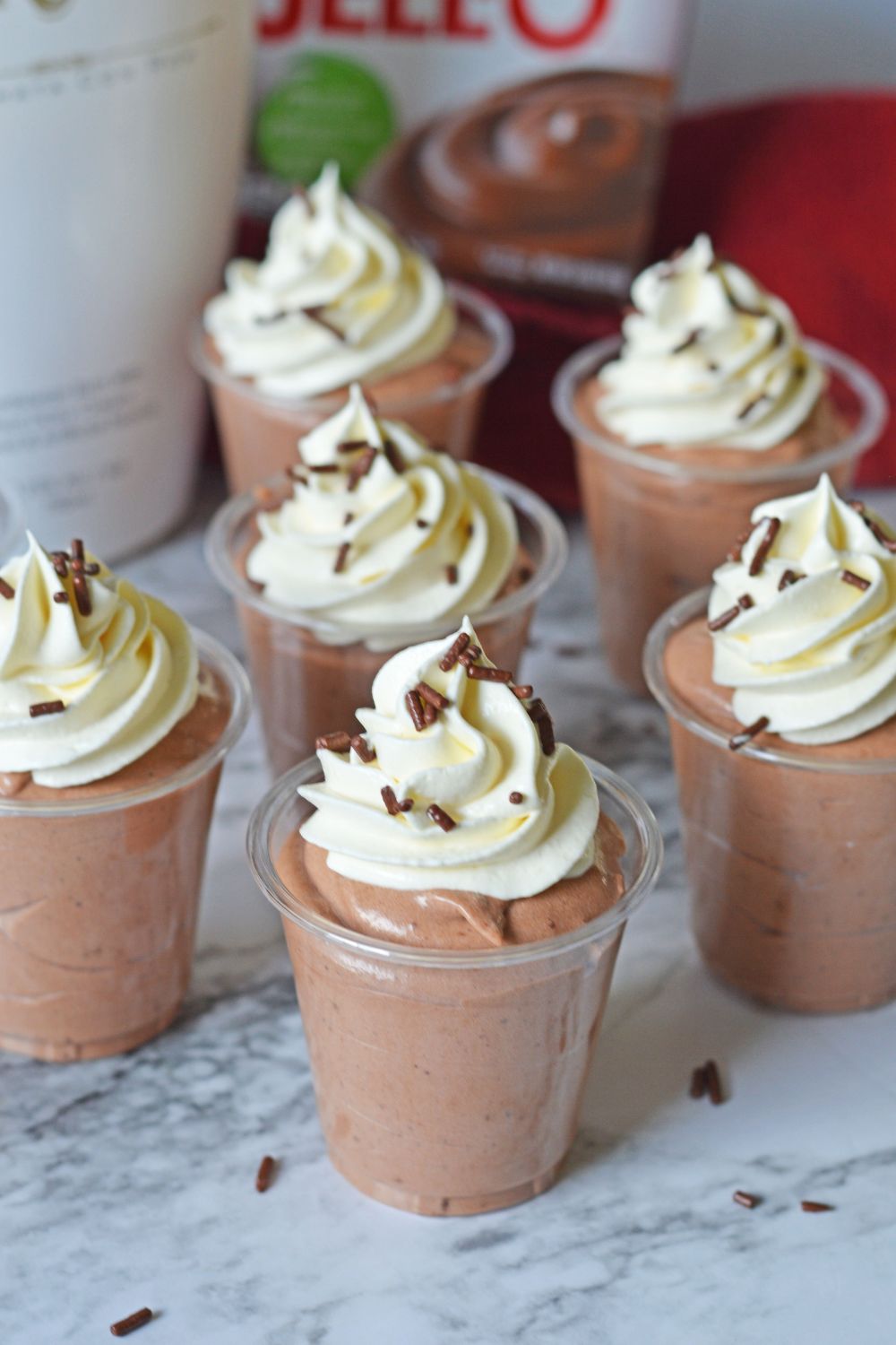 Rumchata Pudding Shots on table with ingredients in background 