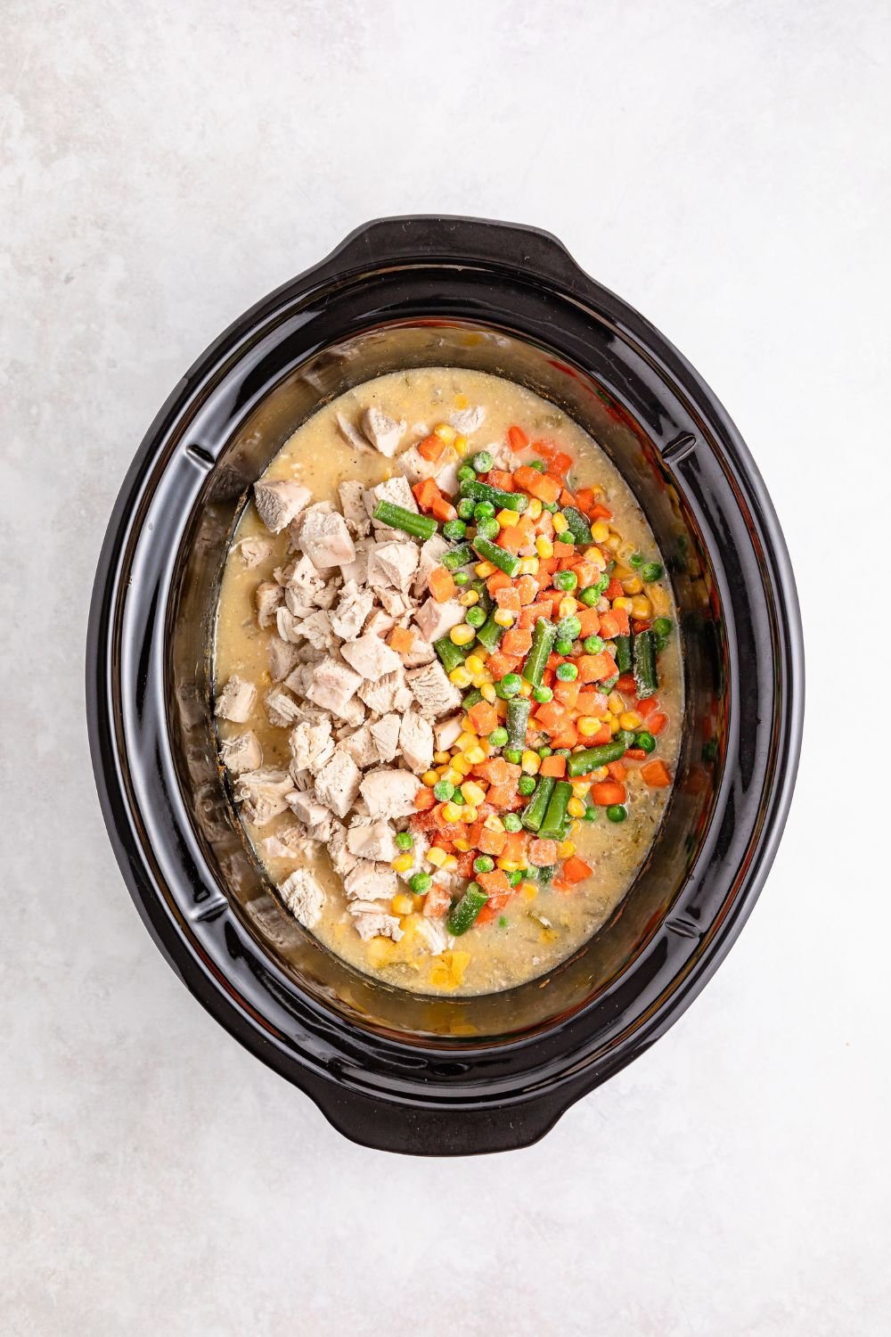 cooked Slow Cooker Chicken Pot Pie in slow cooker on table 