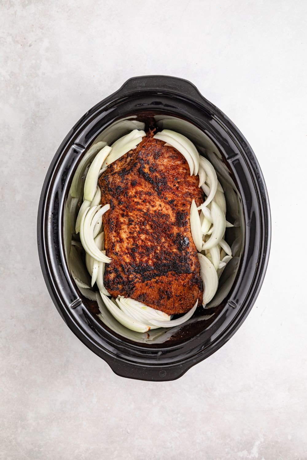 brisket and onions in a slow cooker 