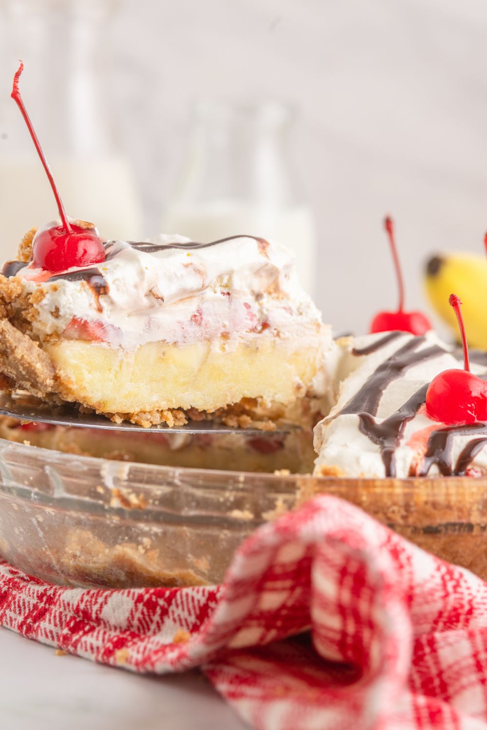 slice of banana split pie lifting out of pan