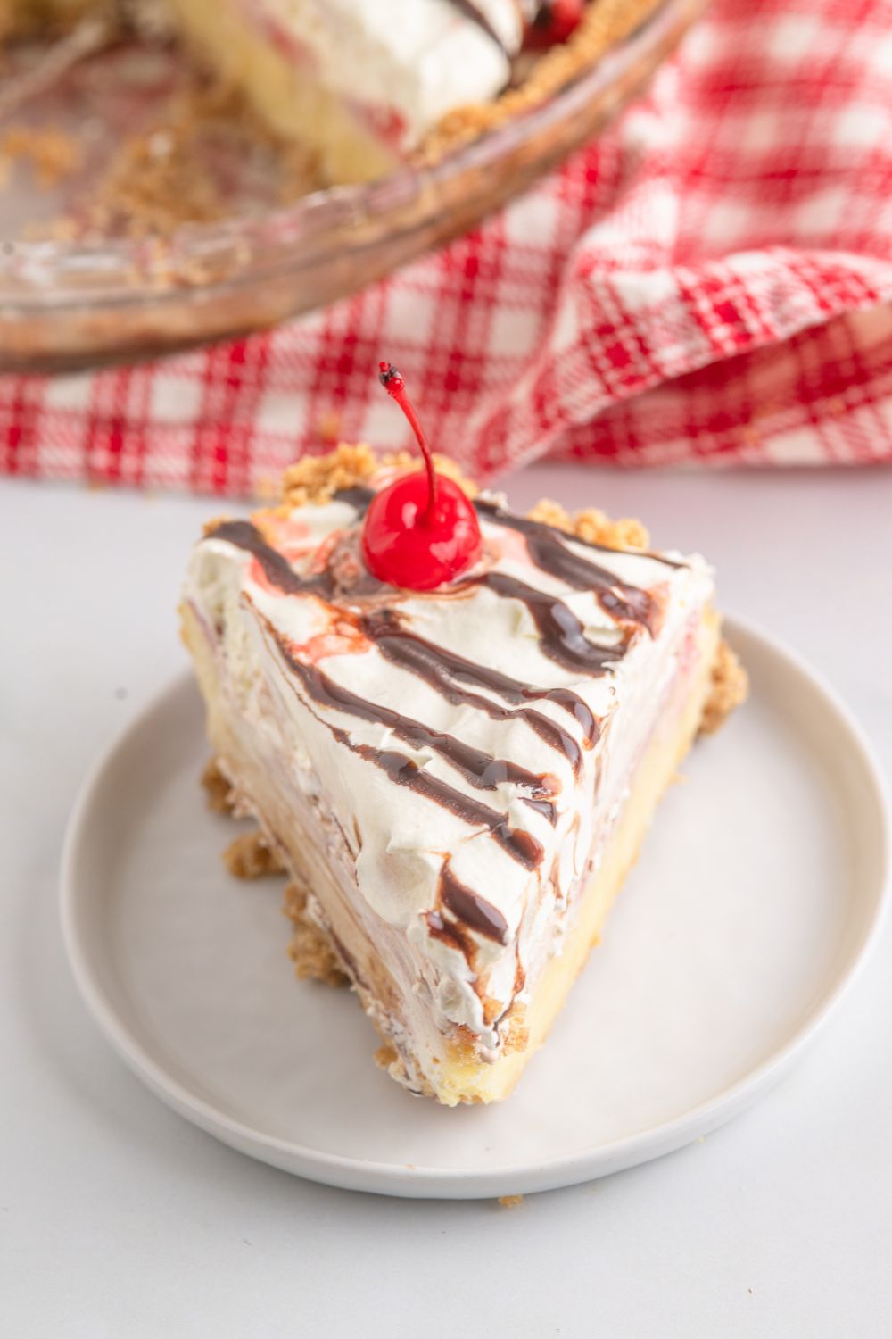 No Bake Banana Split Pie sliced on plate 