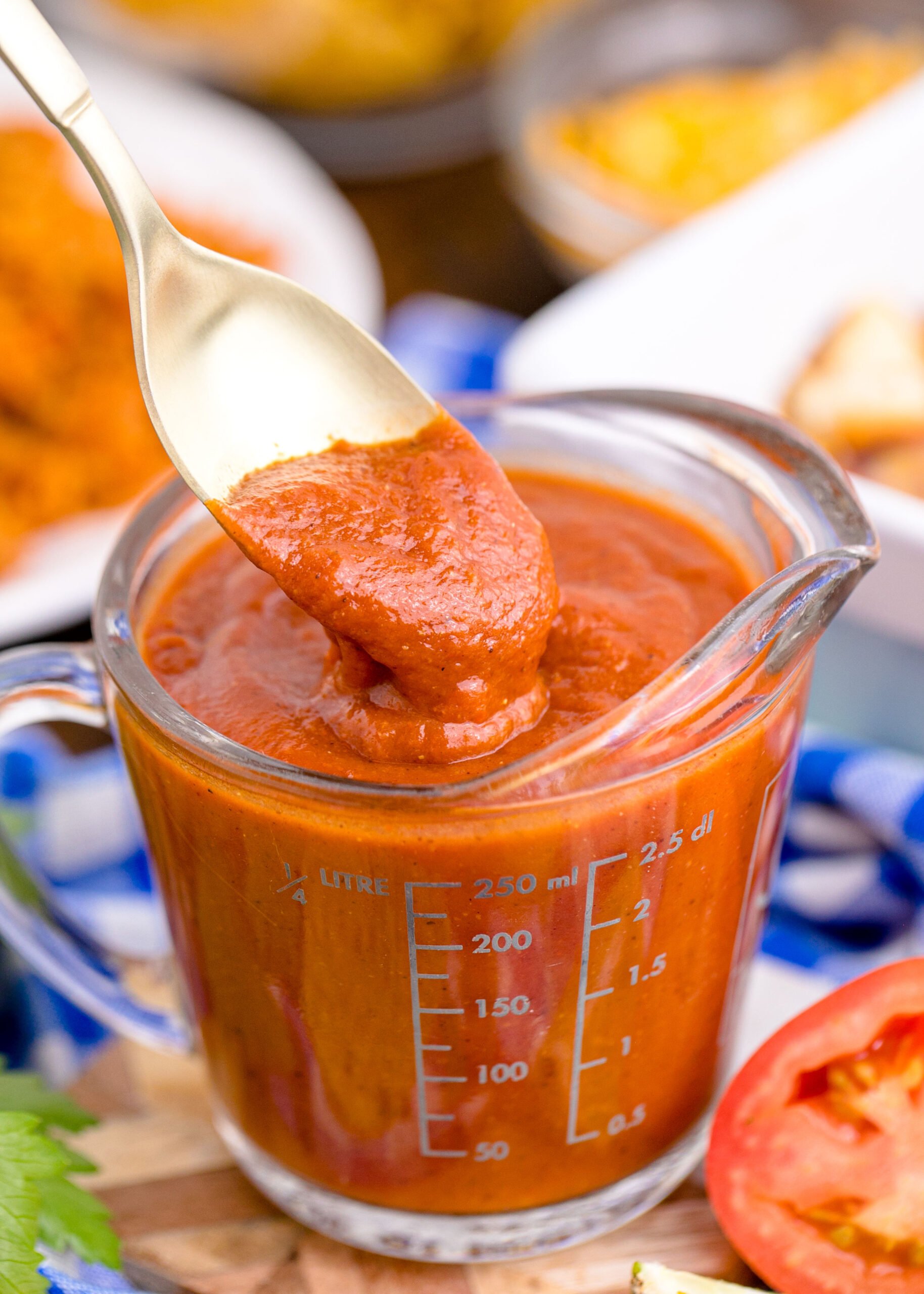 spoon with Homemade Enchilada Sauce on it 