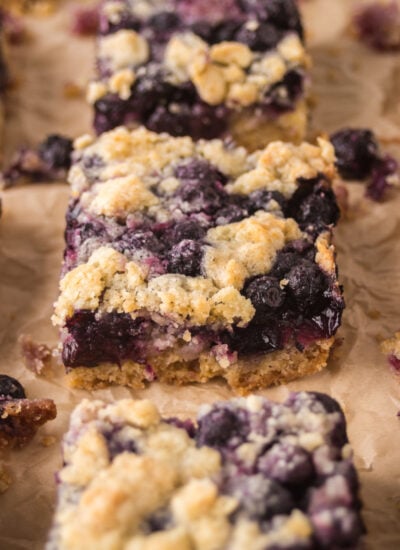 Blueberry Crumb Bars on brown parchment paper