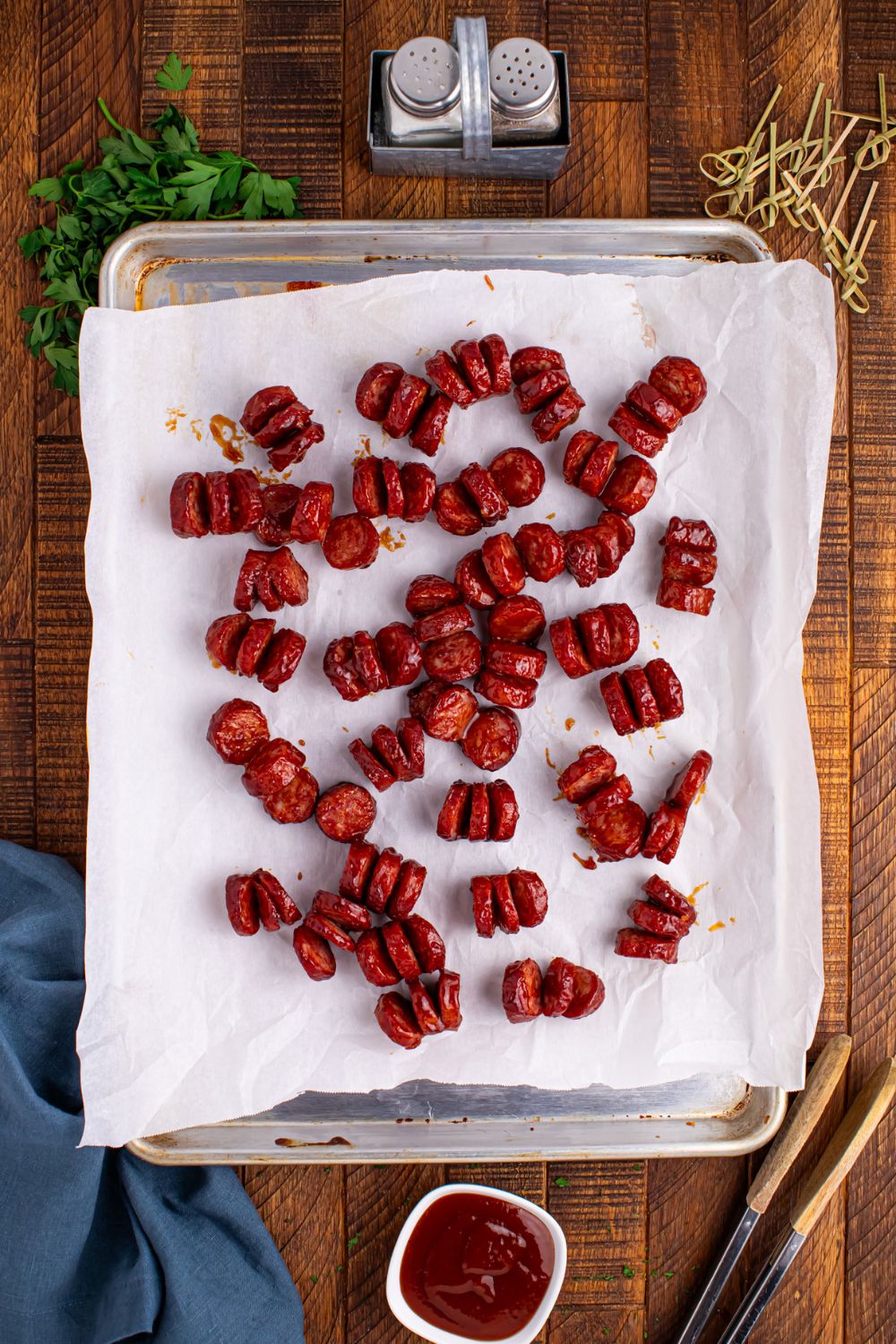 cooked BBQ Hasselback Smoked Sausages on a tray