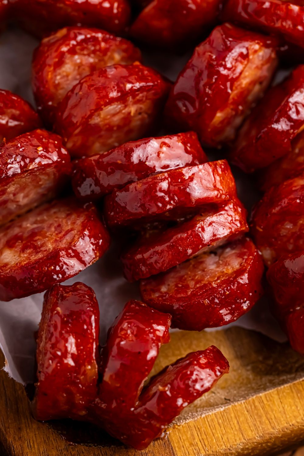 BBQ Hasselback Smoked Sausages on table close up to see the accoradian style cuts 