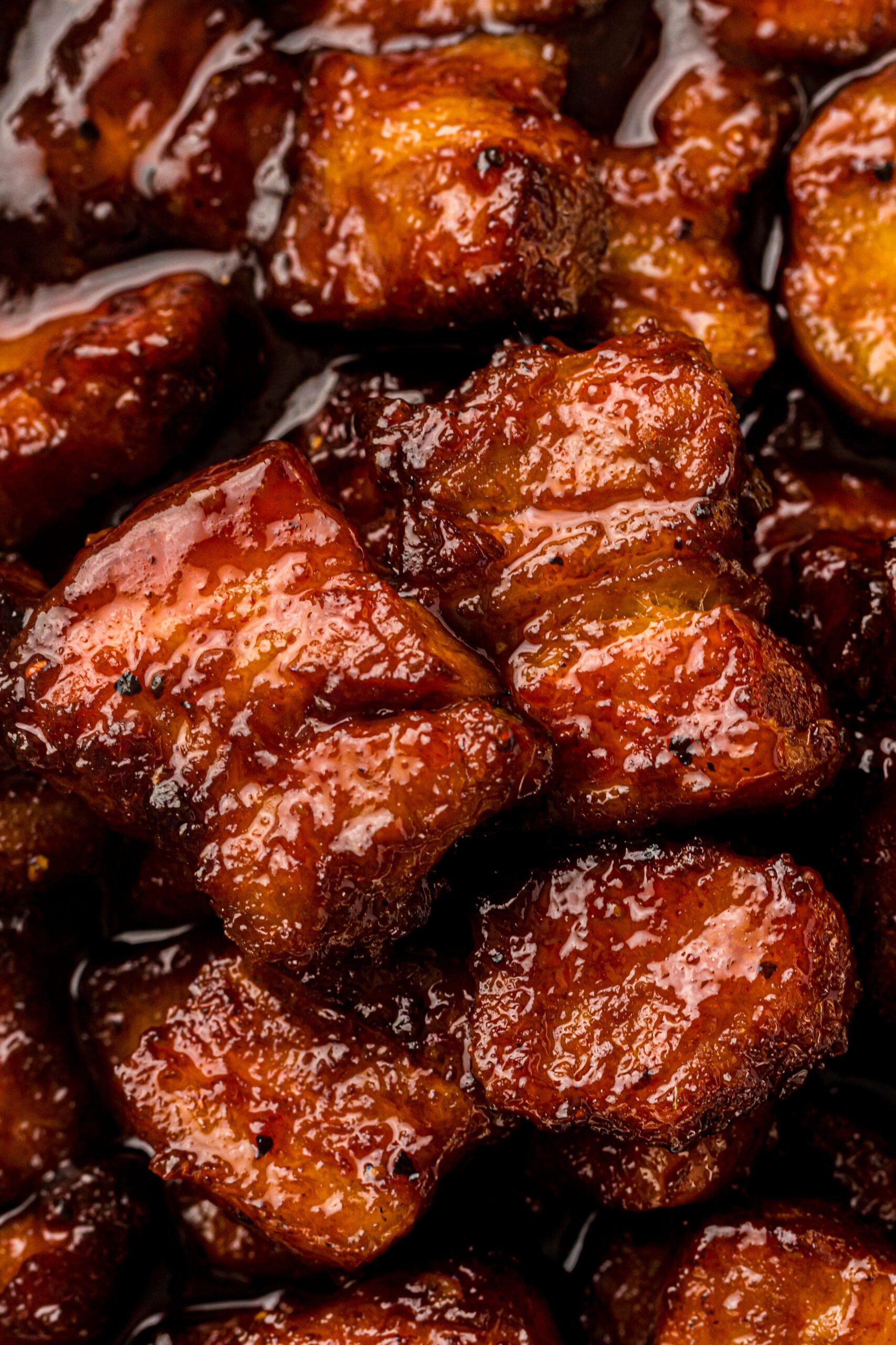 Smoked Pork Belly Burnt Ends in a baking pan 