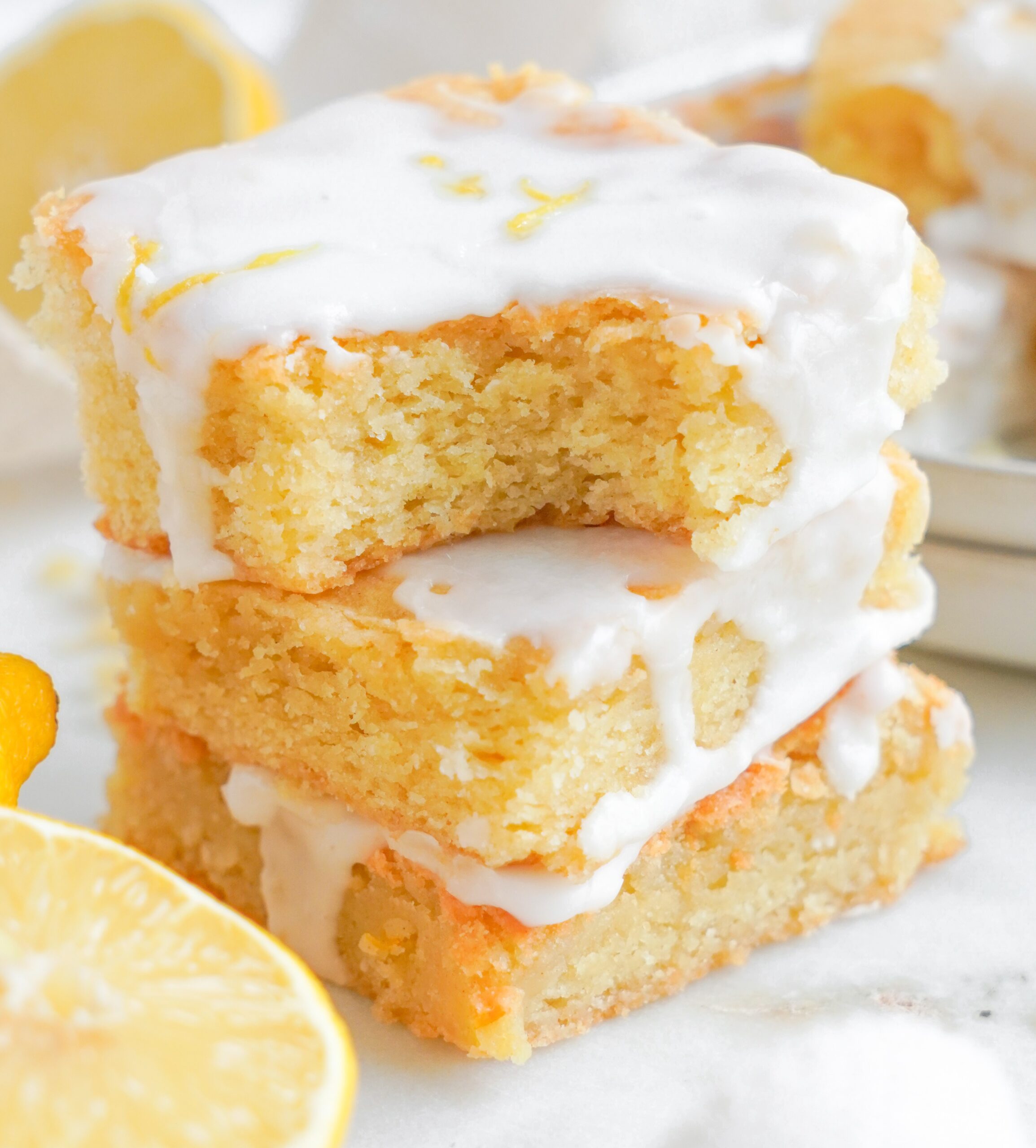 Lemon Sugar Cookie Bars up close with a bite missing 