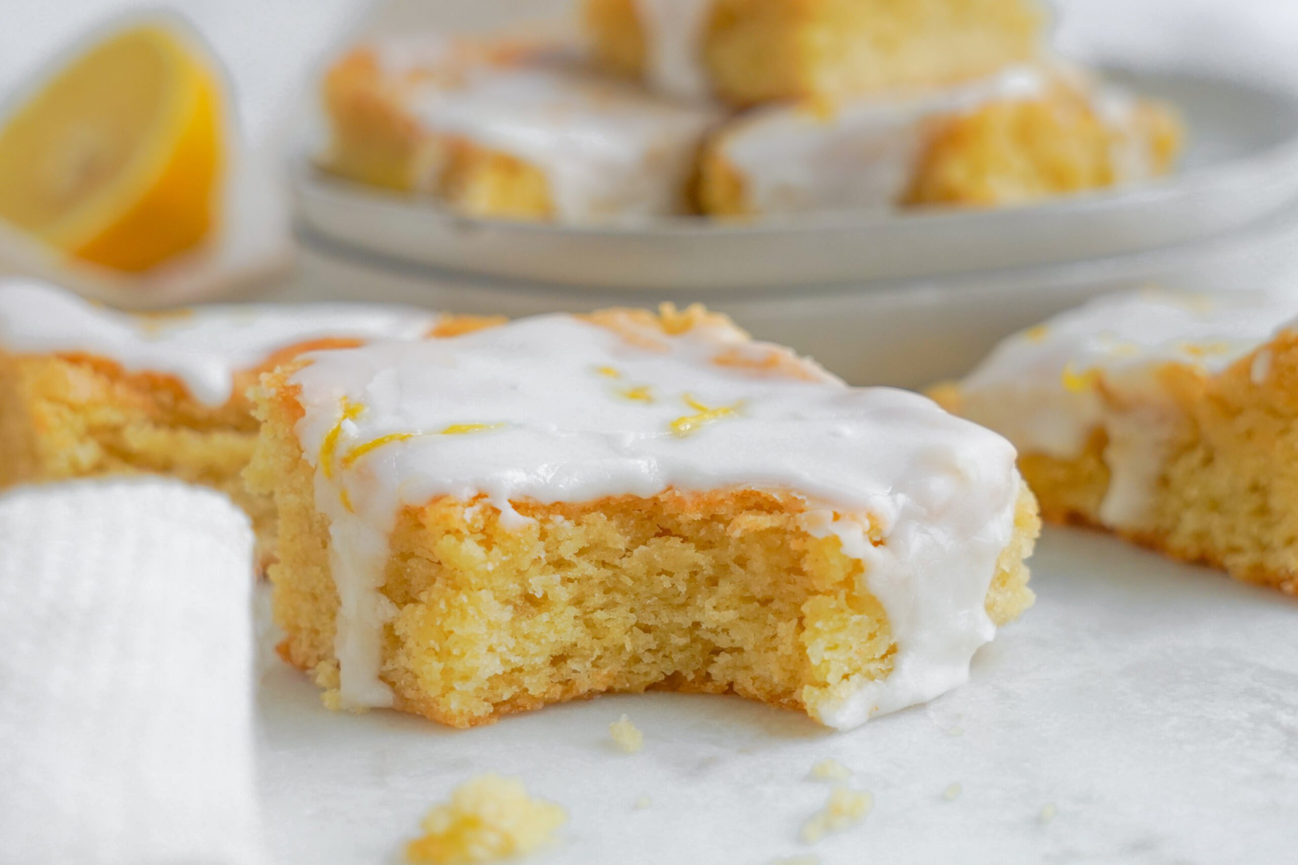 lemon bar up close with a bite missing 