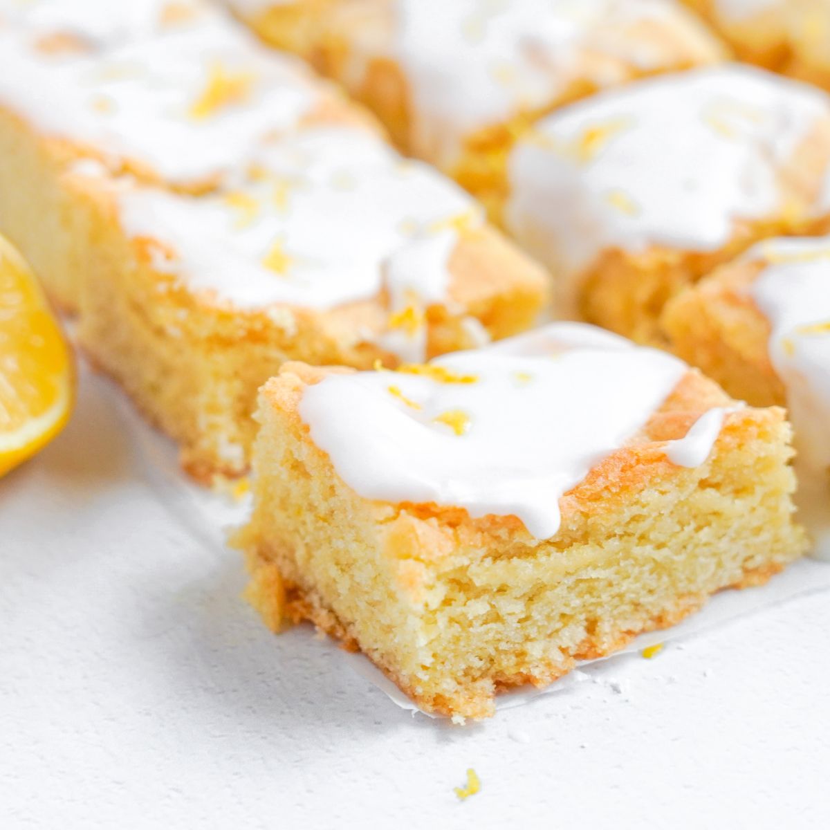Lemon Sugar Cookie Bars cut and sat on table 