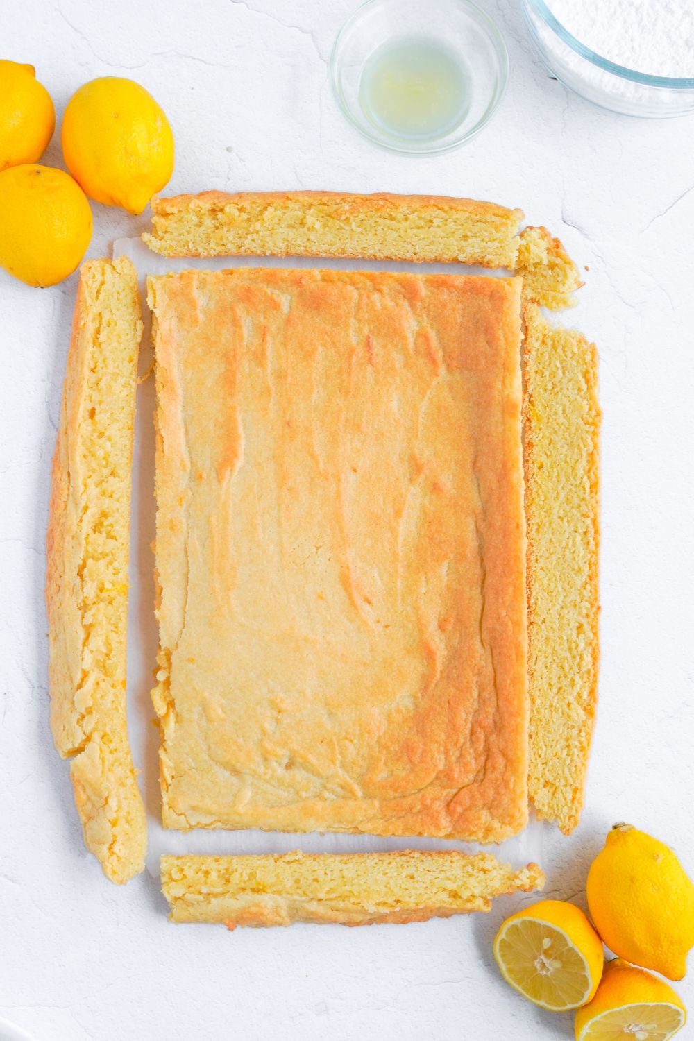 edges of lemon bars cut off to make a rectangle 