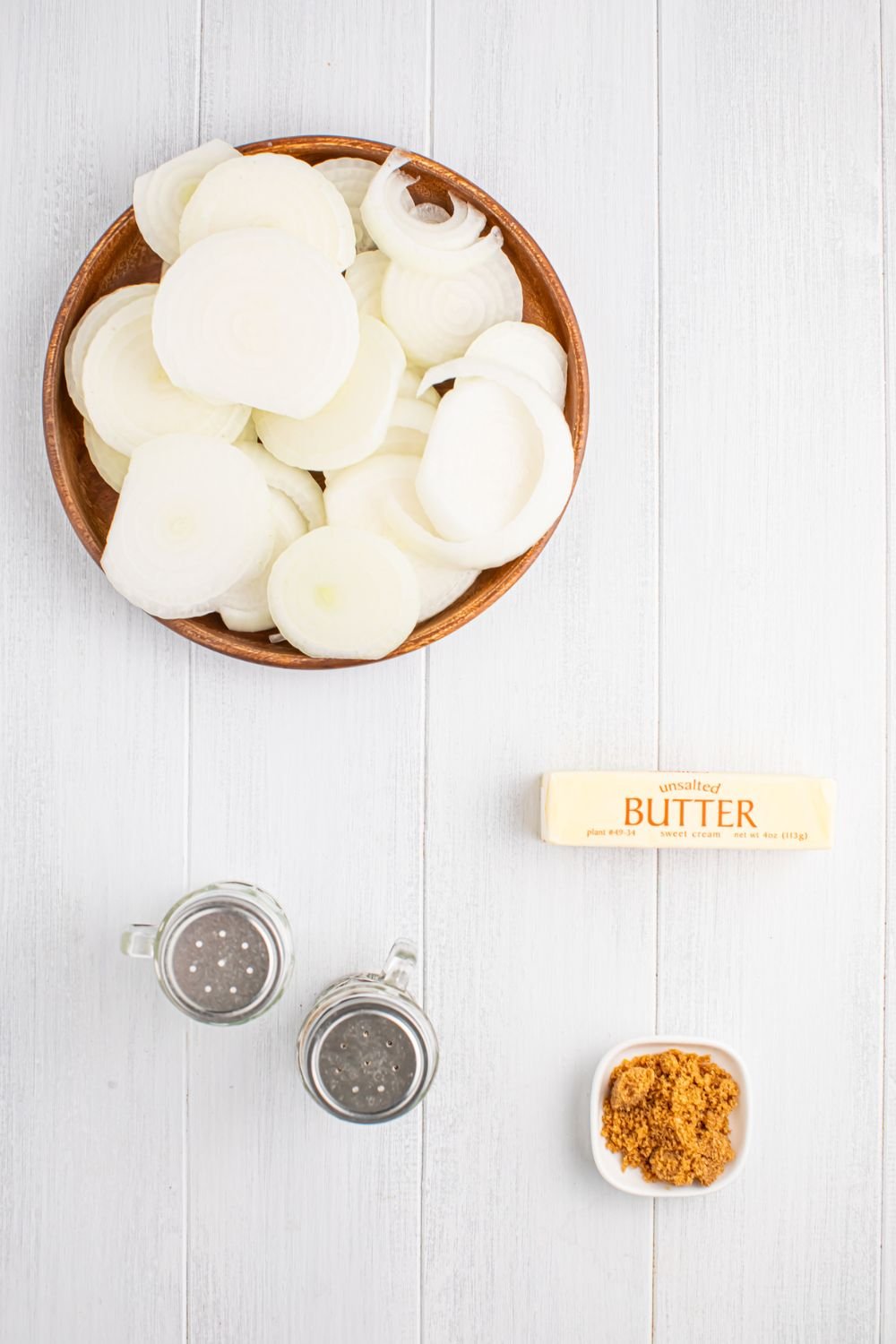 ingredients for CrockPot Caramelized Onions on table in single serve containers
