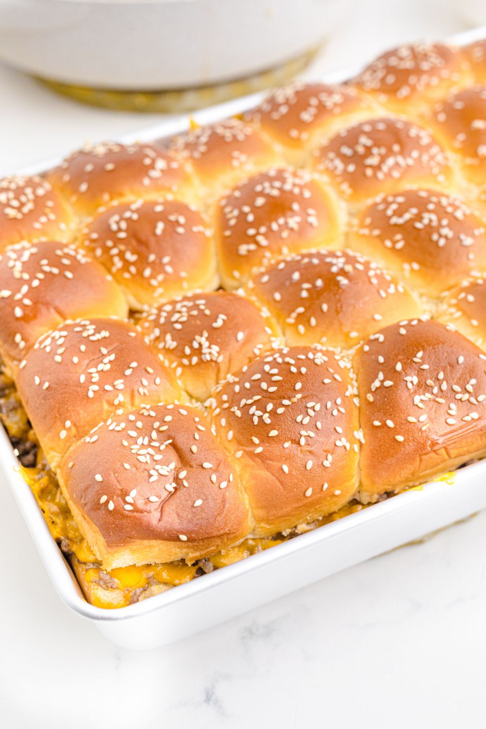side view of Classic Cheeseburger Sliders in a pan 