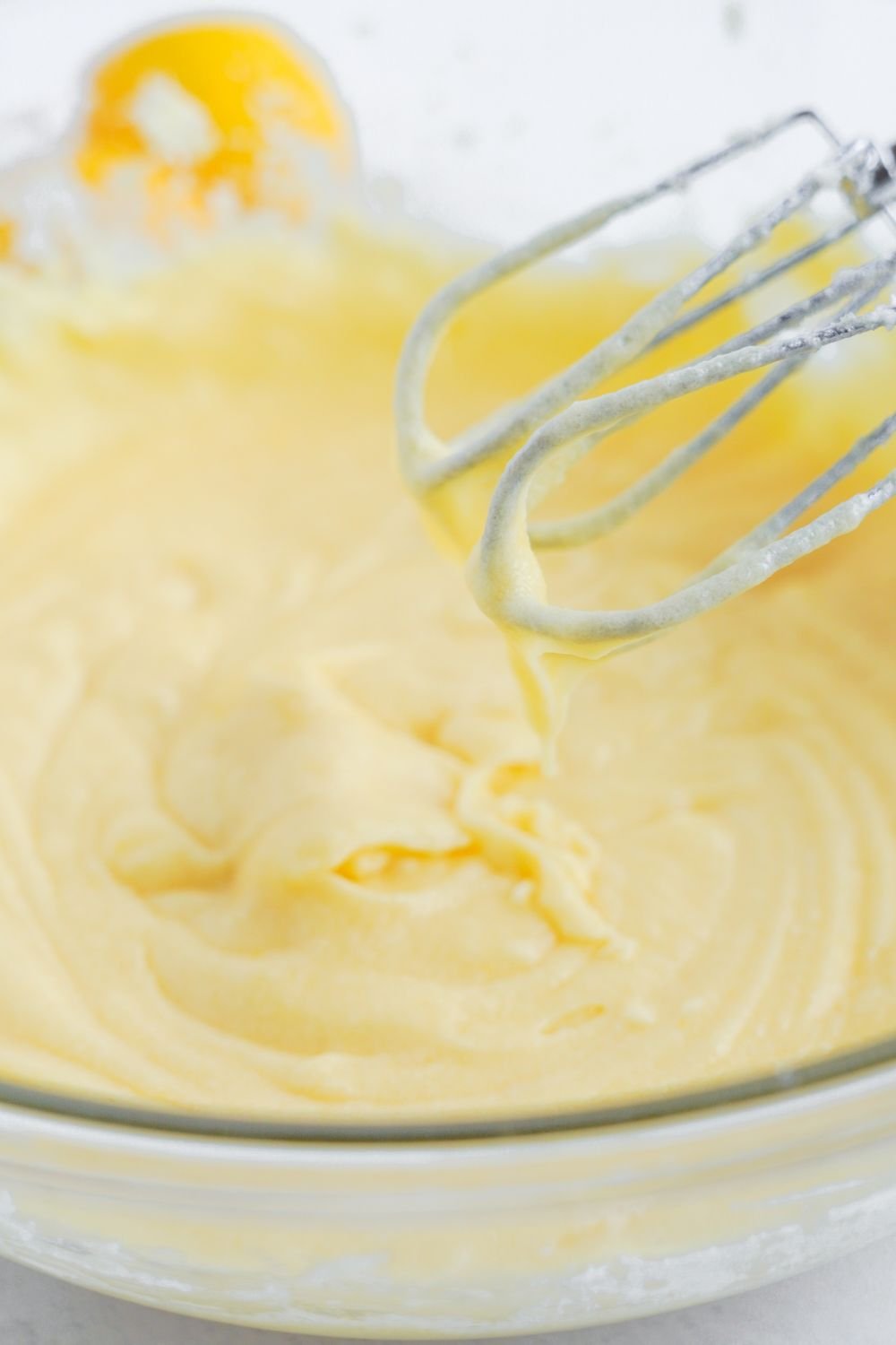 whipped batter for Lemon Sugar Cookie Bars in a glass bowl
