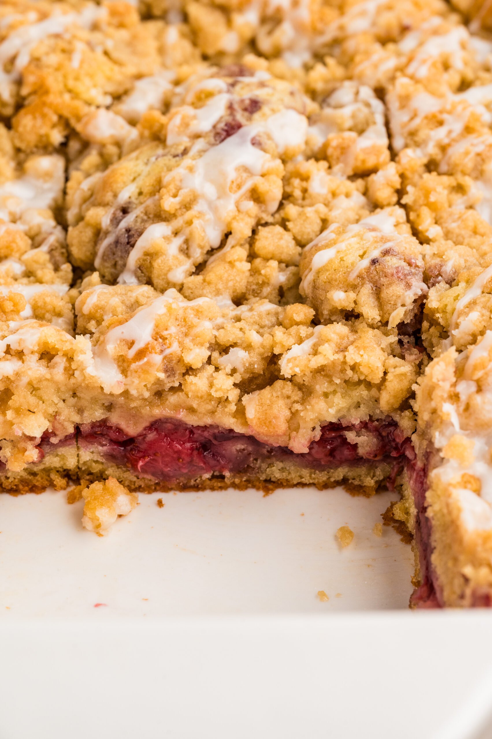 Strawberry Coffee Cake in a baking pan up close to show topping 