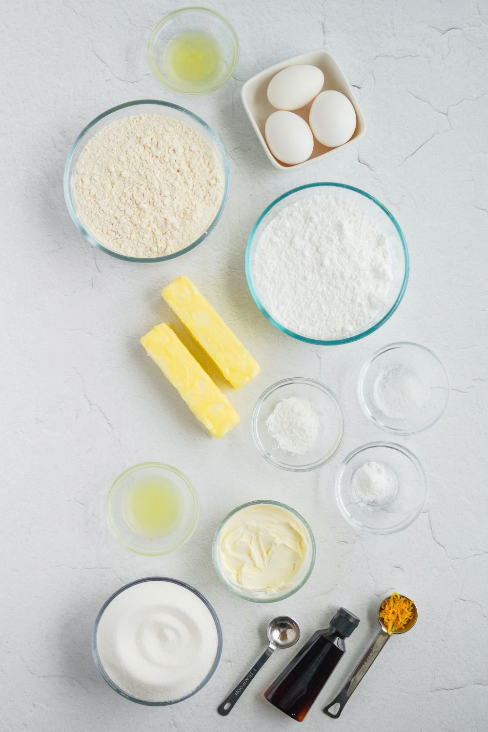 ingredients for Lemon Sugar Cookie Bars in single serve containers on table 