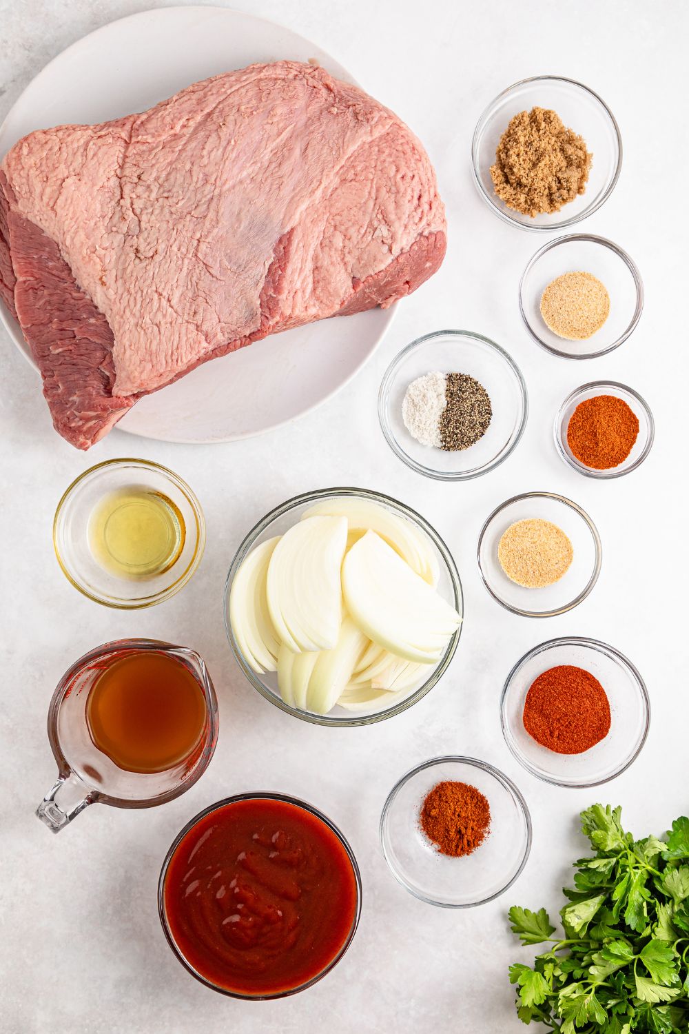 all the spices and ingredients to make Slow Cooker BBQ Brisket spread out on table 