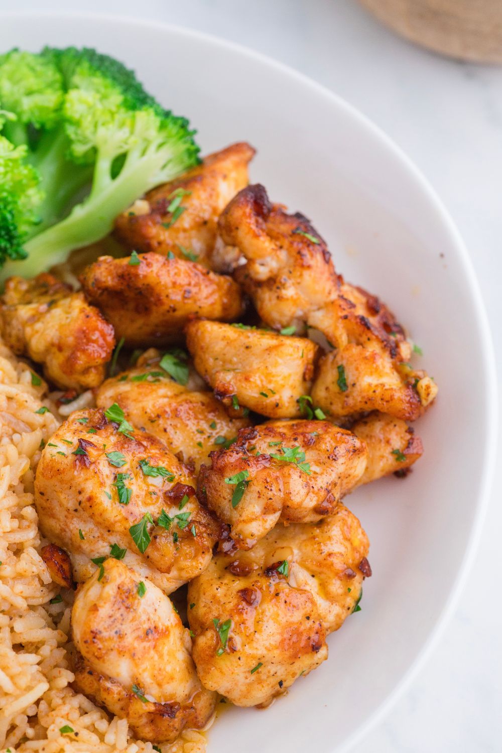 close up view of Garlic Butter Chicken Bites on table 