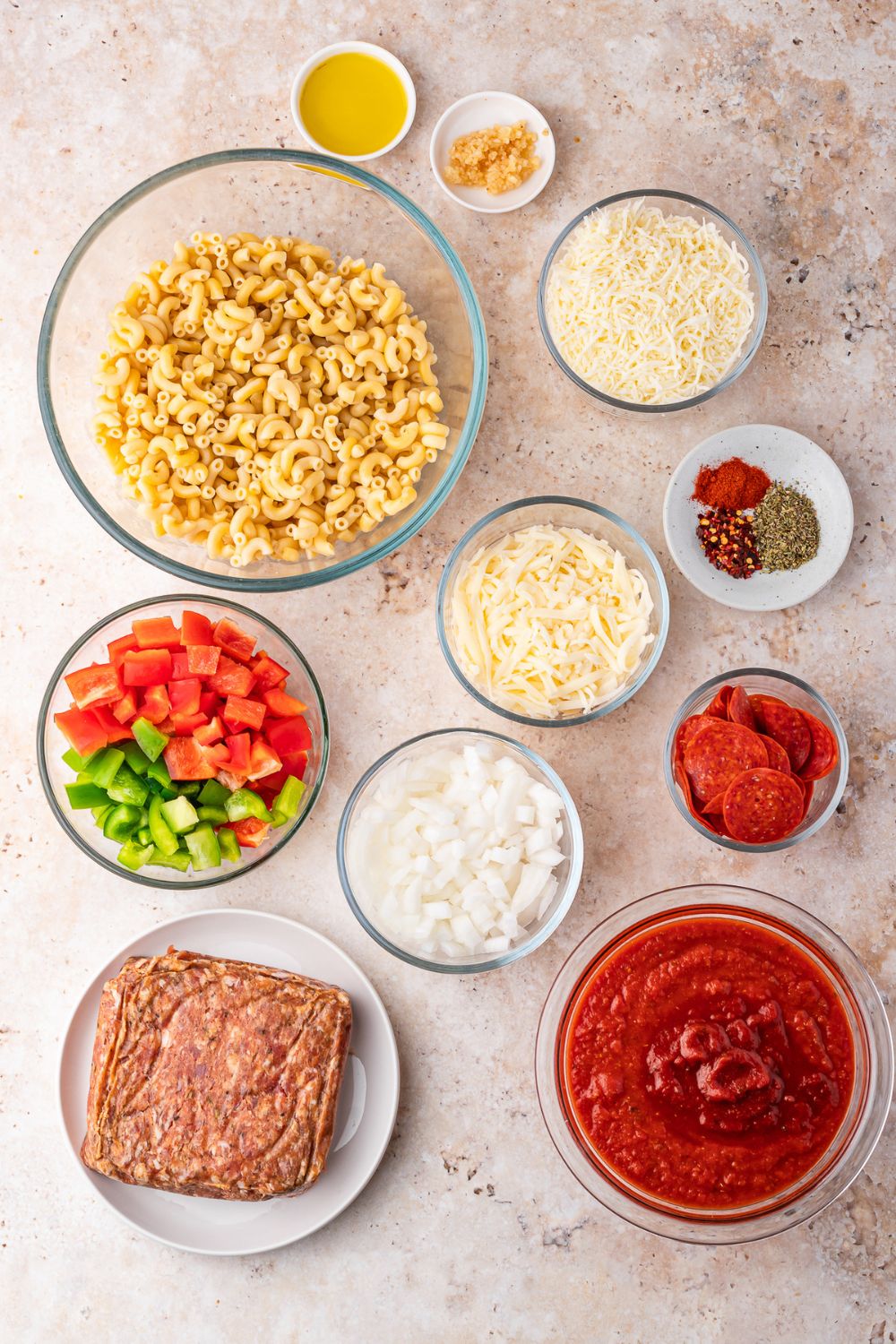 ingredients for Slow Cooker Pizza Casserole in single serve bowls on table 