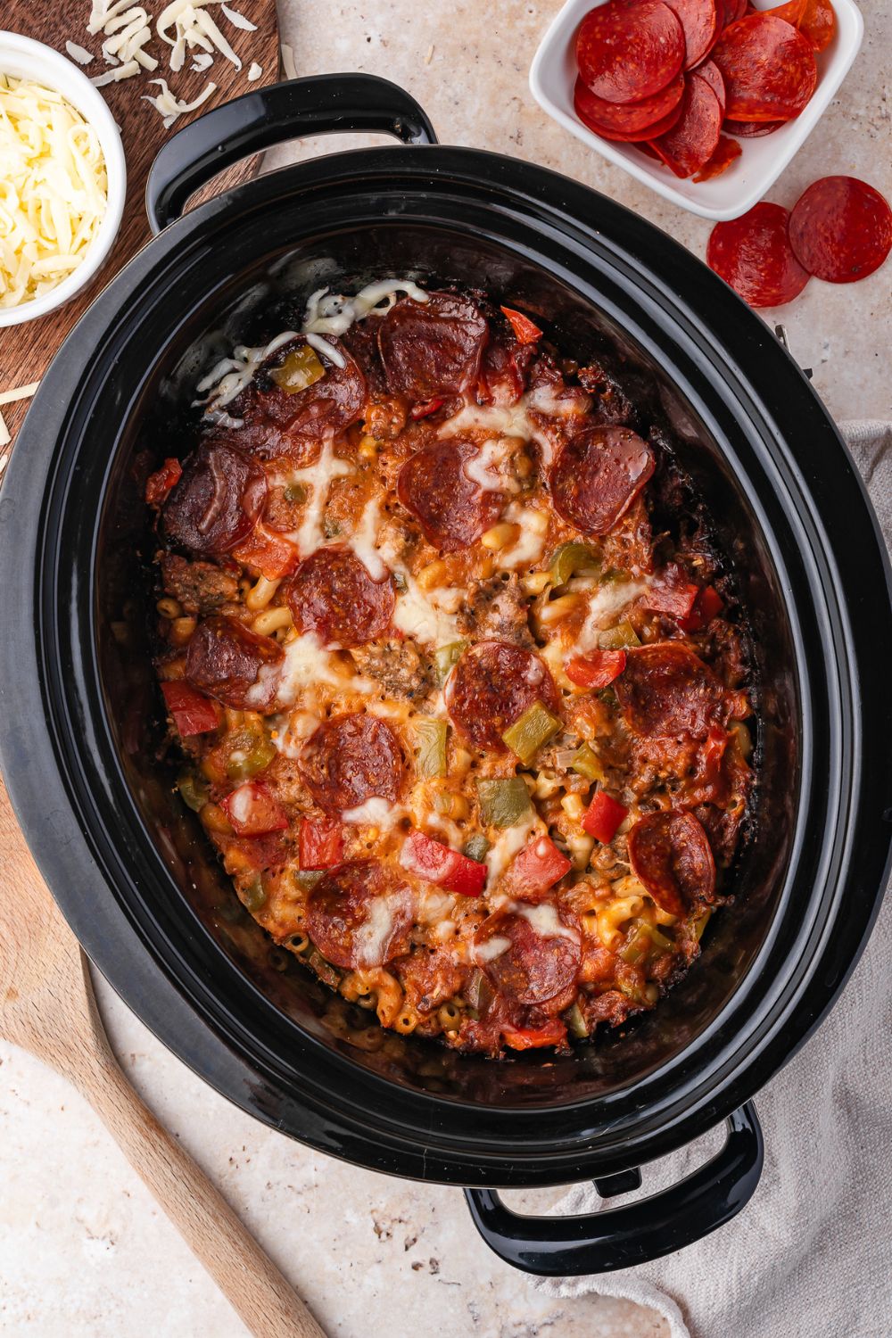 overhead look of slow cooker with Slow Cooker Pizza Casserole in it 