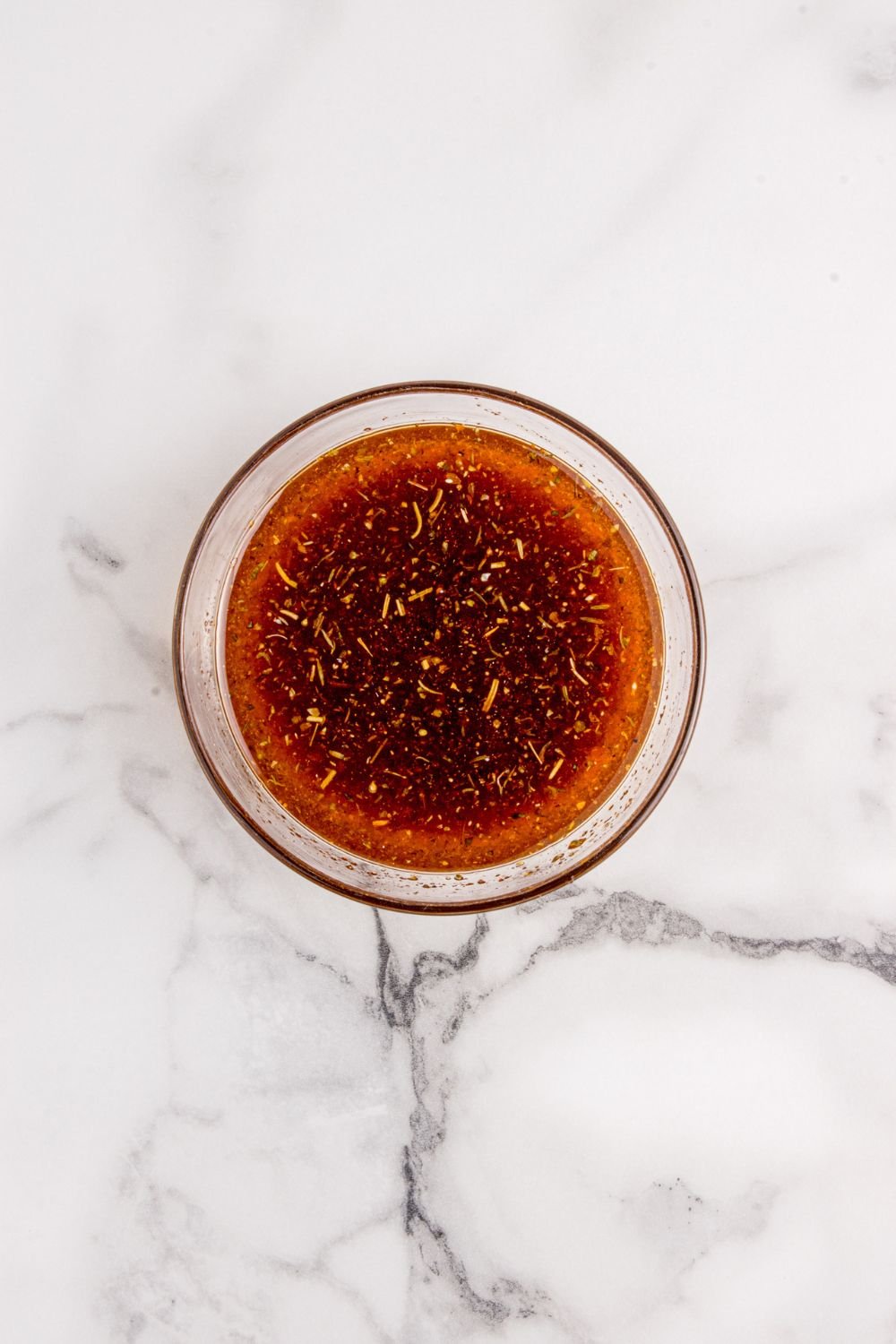 bowl with a liquid marinade in it 