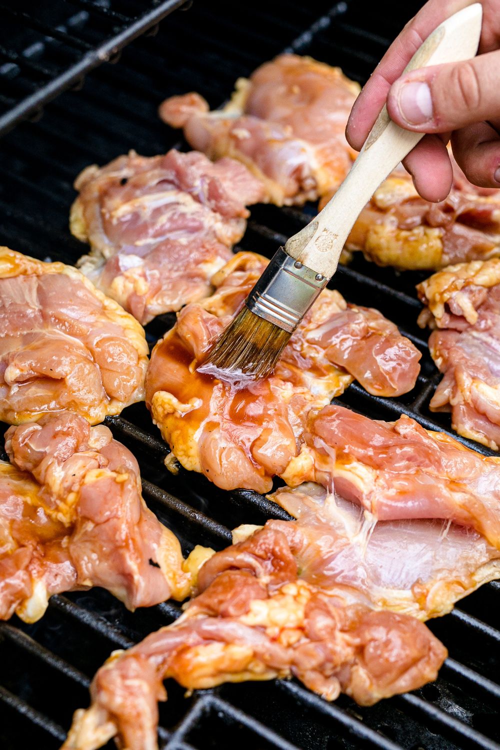 Huli Huli Chicken being basted on grill