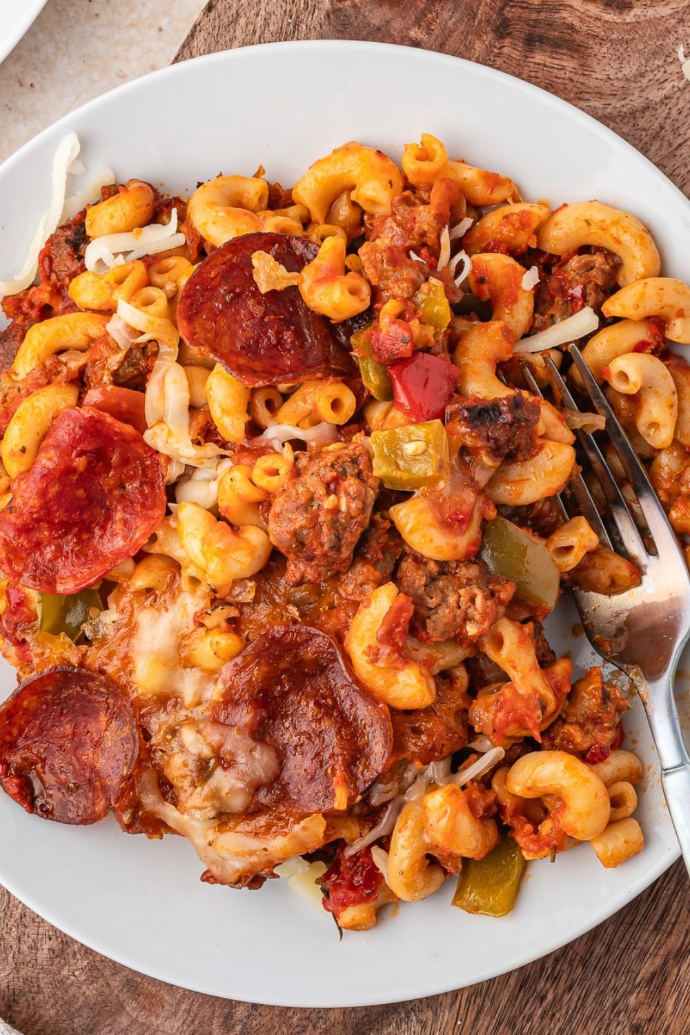 plate with pizza casserole on it, and a fork to side of plate