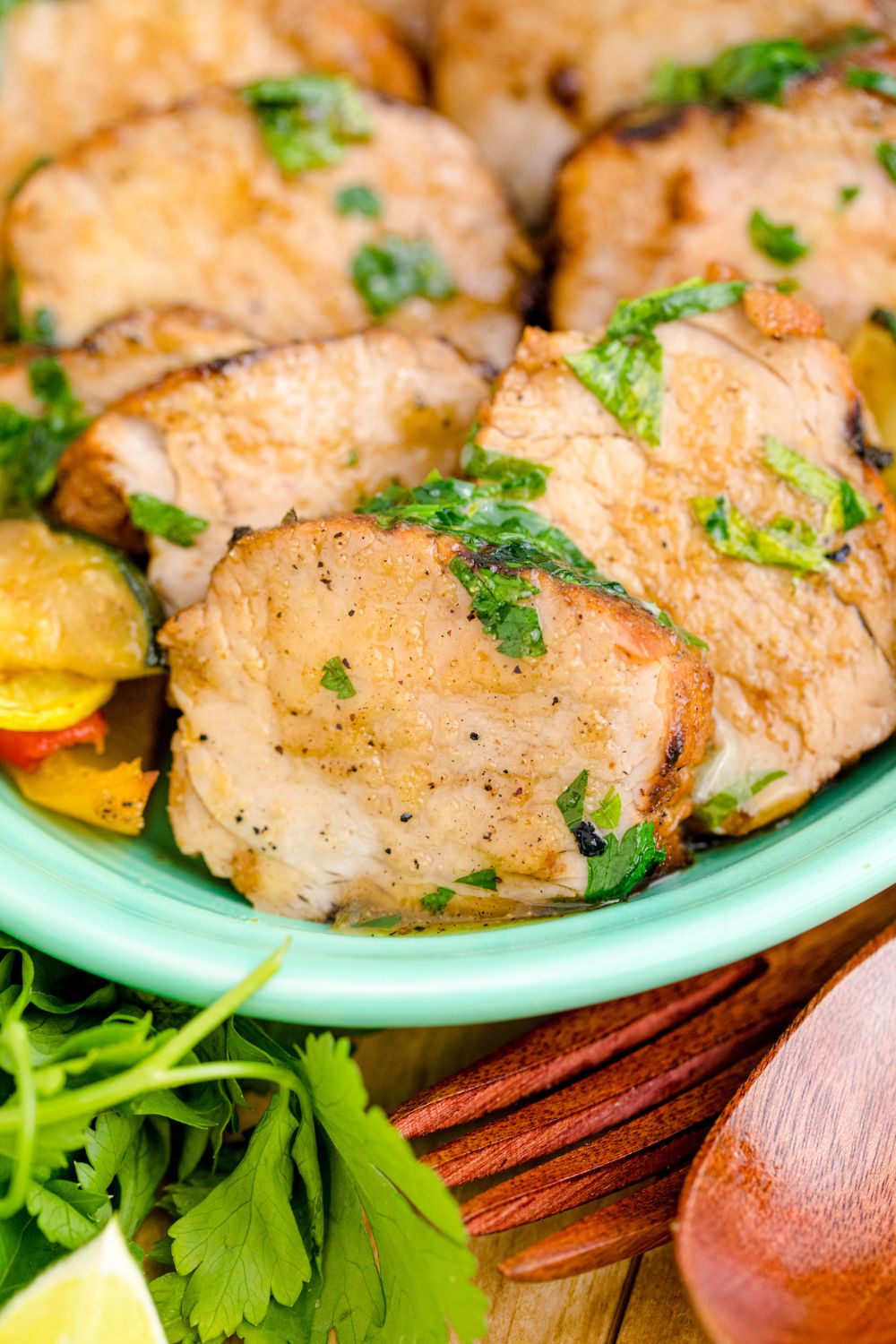 close up of sliced pork tenderloin on table 